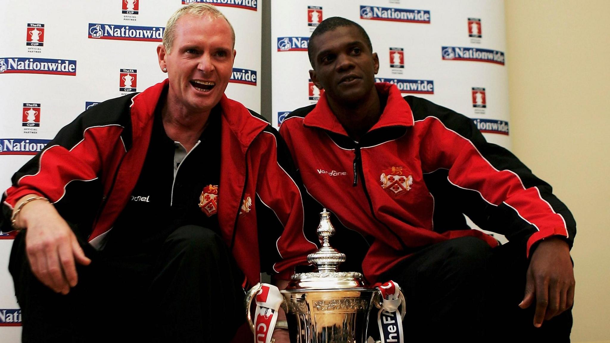 Paul Gascoigne and Paul Davis with the FA Cup during a visit to a Kettering school