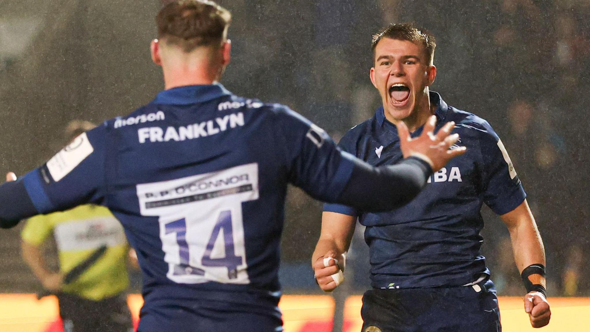 Tom Roebuck and Joe Carpenter celebrate while playing for Sale