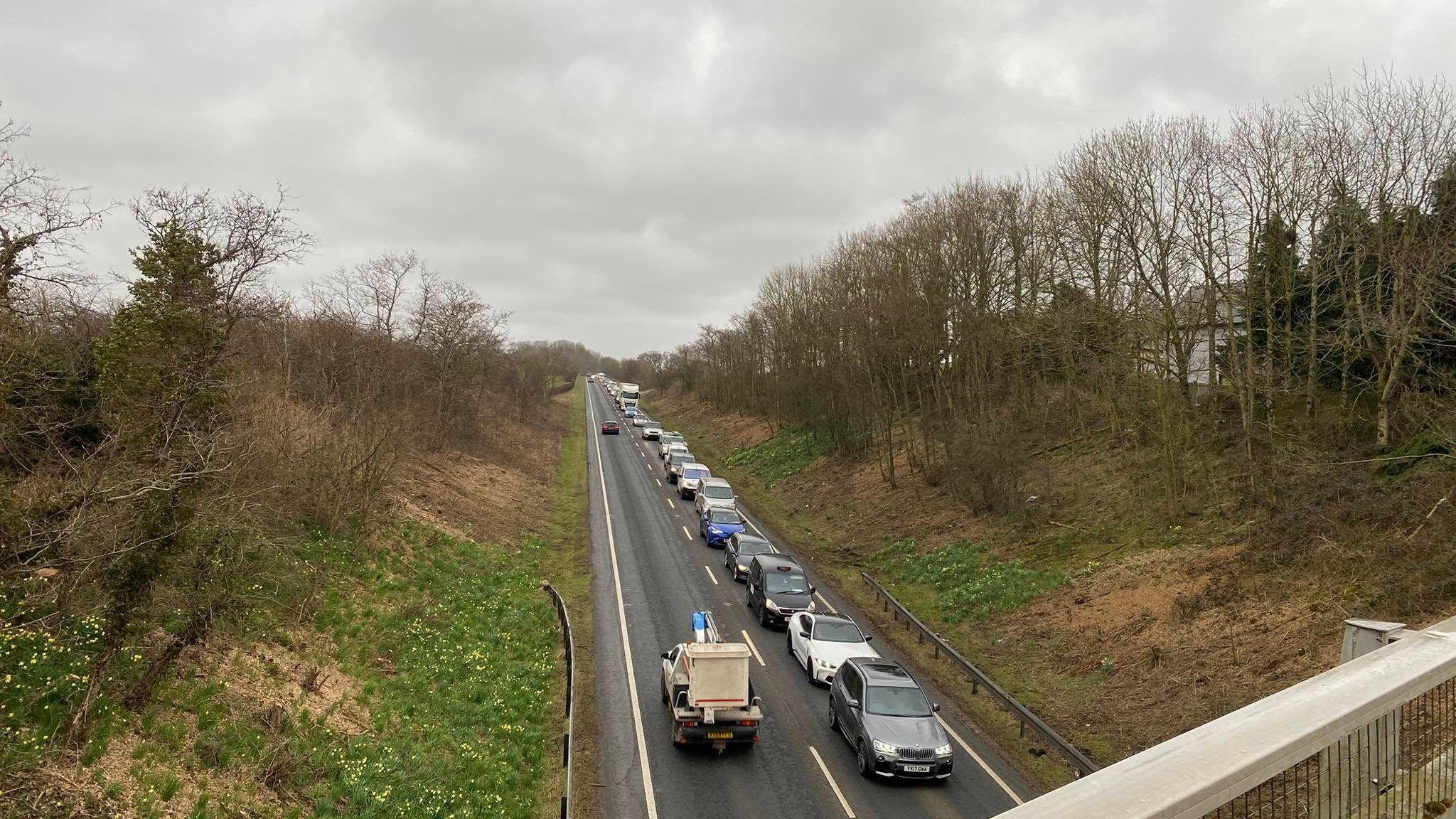 Large queue of vehicles pictured queuing on the A595