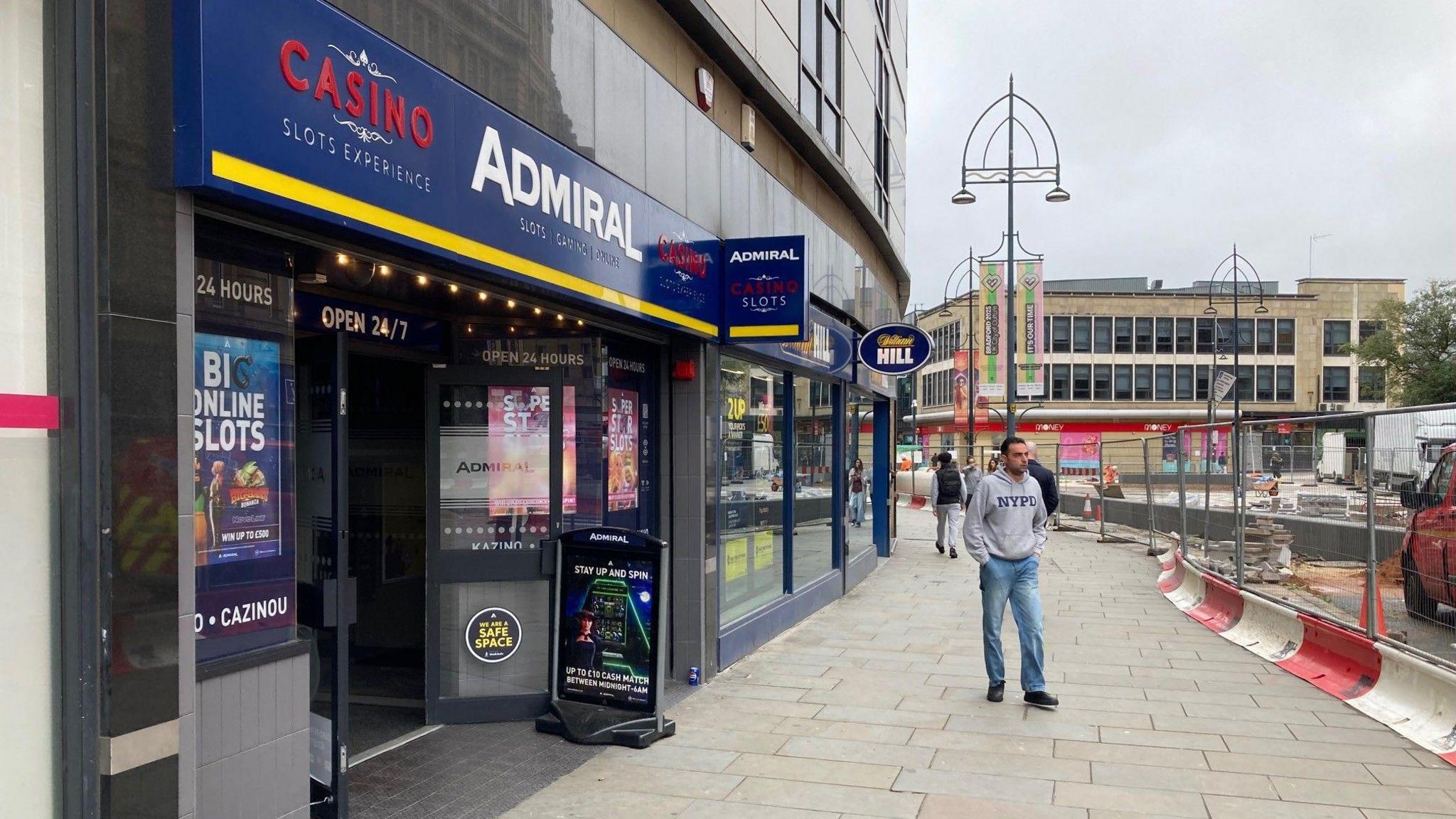 A man walks past the amusement arcade on Broadway which is currently being pedestrianised