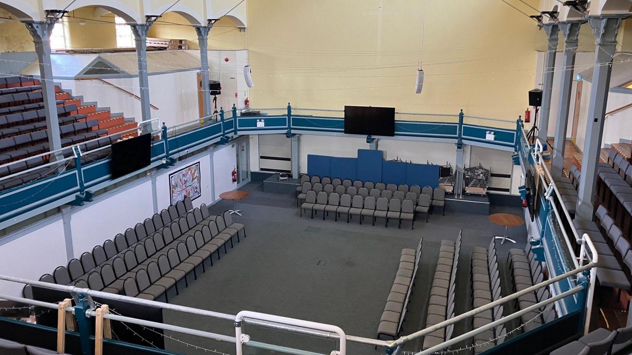 The inside of the Citadel showing high ceilings and seating below