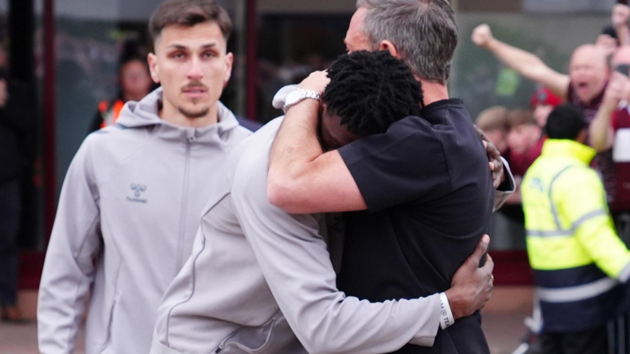Hearts striker Pierre Landry Kabore is consoled by head coach Derek McInnes