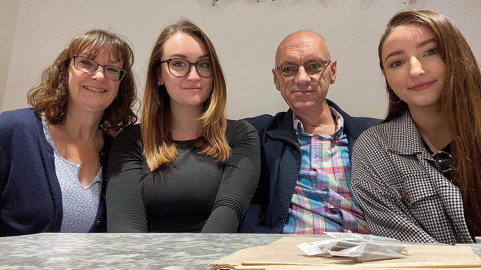 Sara-Jane, Megan, Paul and Lizzie Sturman sat in front of a table