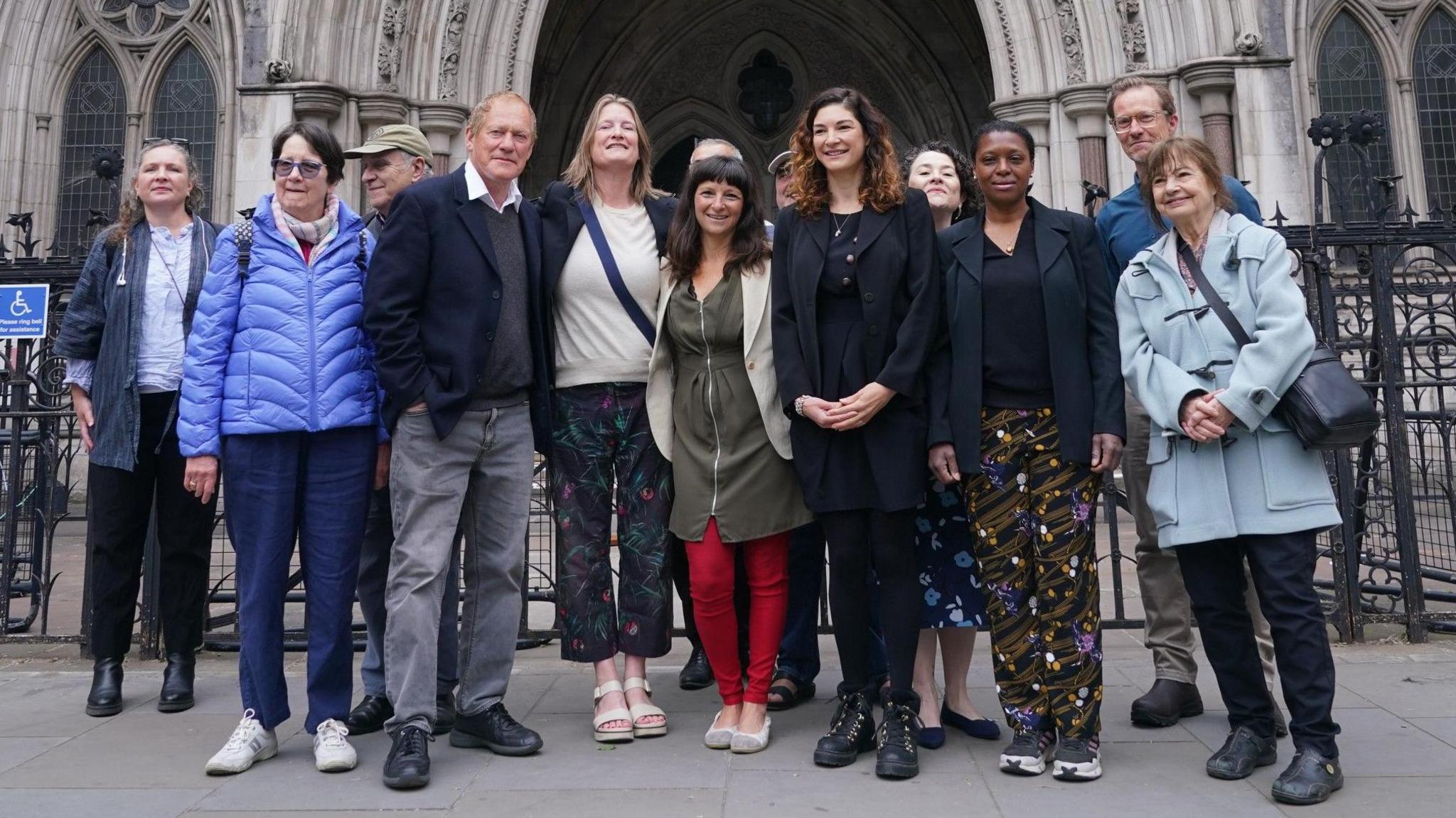 Rebekah Shaman, from the Protect Brockwell Park Group, stands with others male and female residents outside the Royal Courts of Justice.