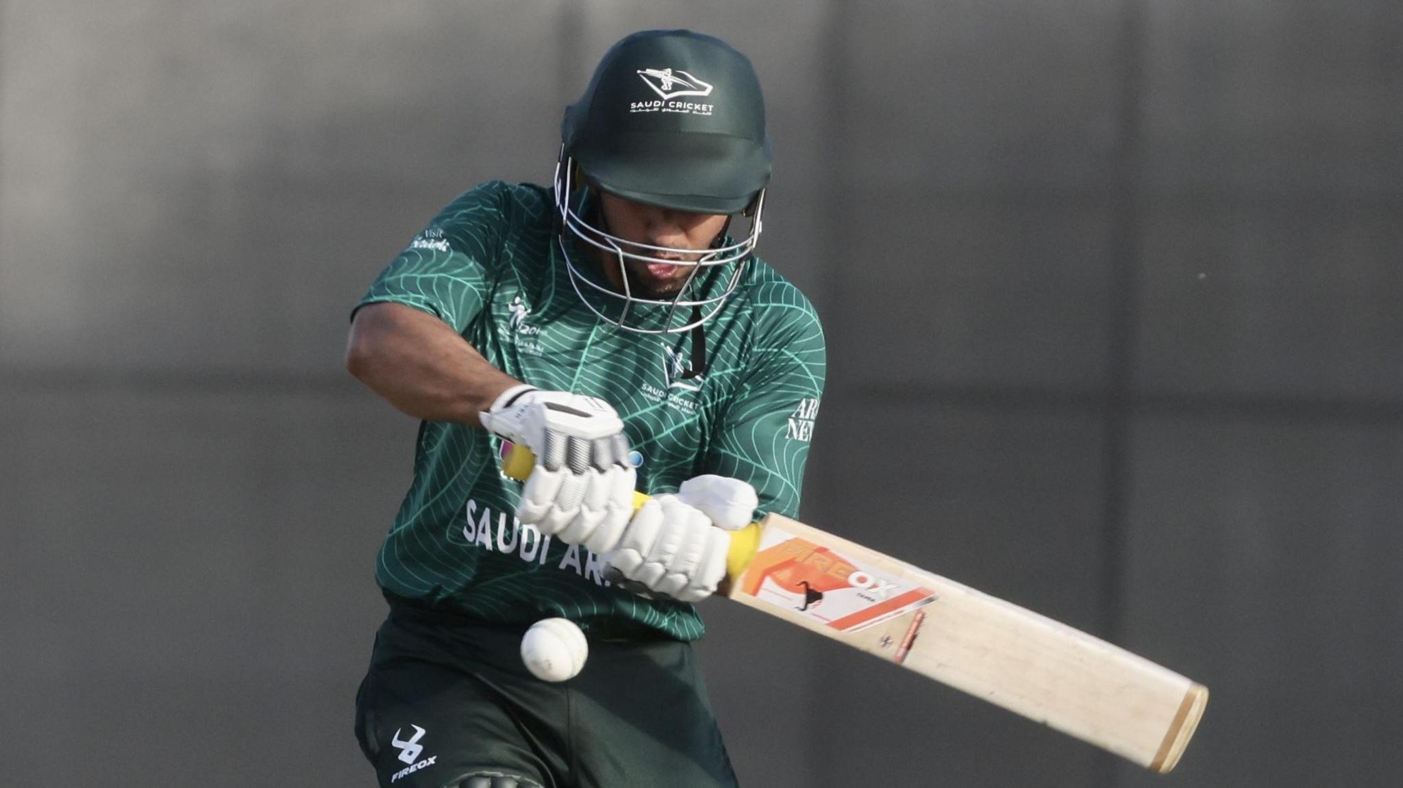 A batter for Saudi Arabia plays a pull short during a T20 international
