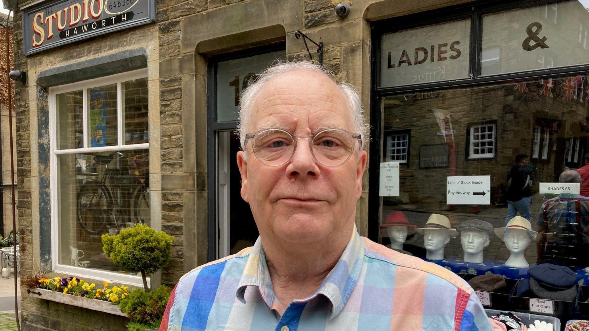 Ian Birch outside his shop on Main Street