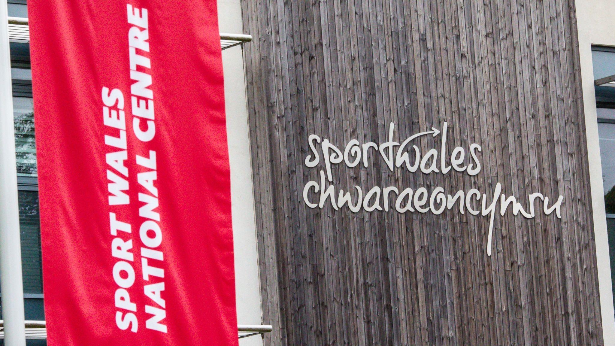 Sport Wales flag and wall logo outside the National Sports Centre in Cardiff