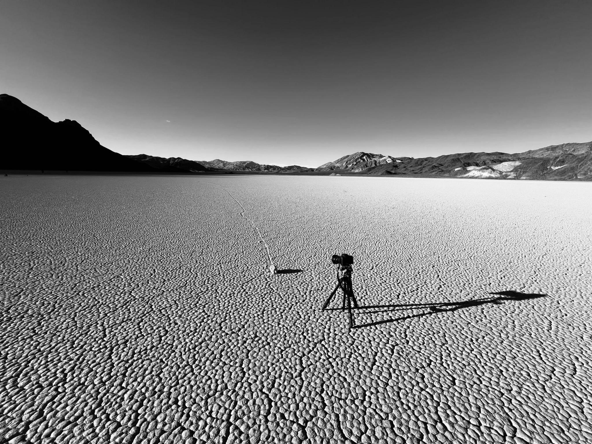 A camera stands on a tripod in Death Valley