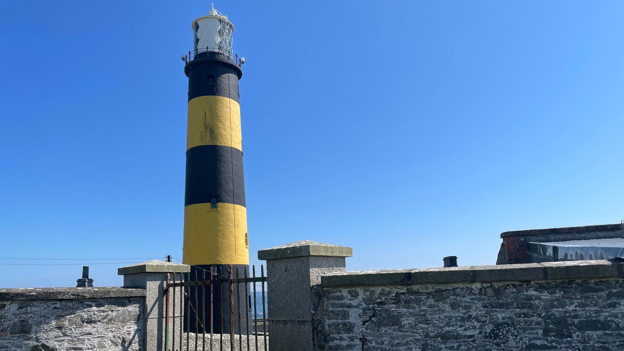 St John’s Point Lighthouse in gorgeous County Down. Its strikingly tall tower is marked with vibrant bands of yellow and black. These vivid colours, which distinguish it from other lighthouses, are known as its daymark.