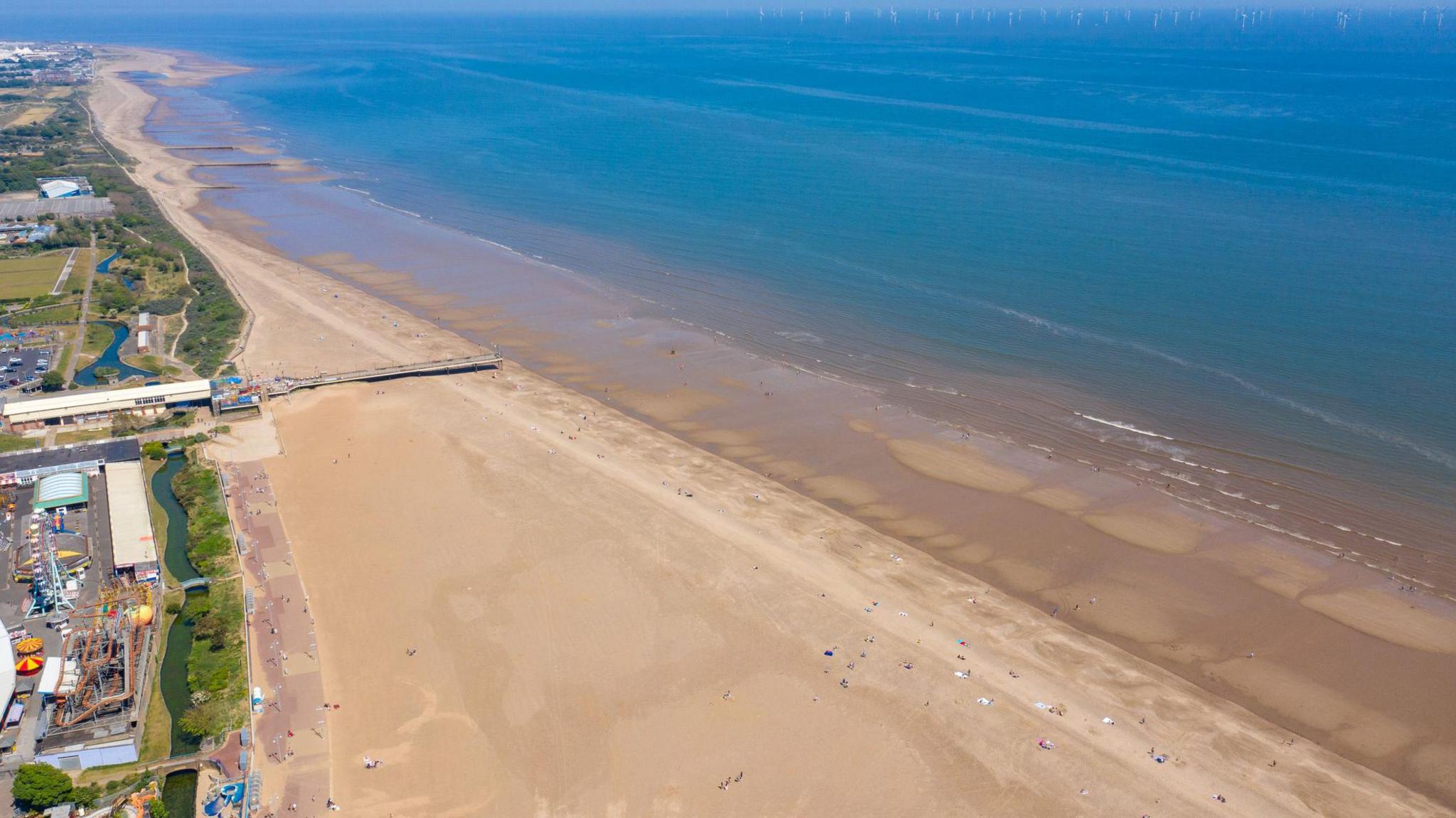 A stock photograph - an aerial shot of Skegness beach on a sunny day.