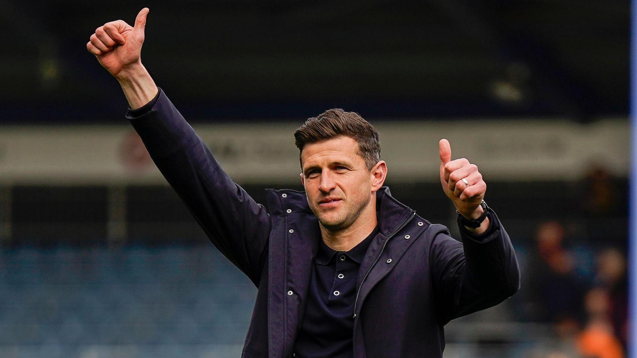 John Mousinho celebrates