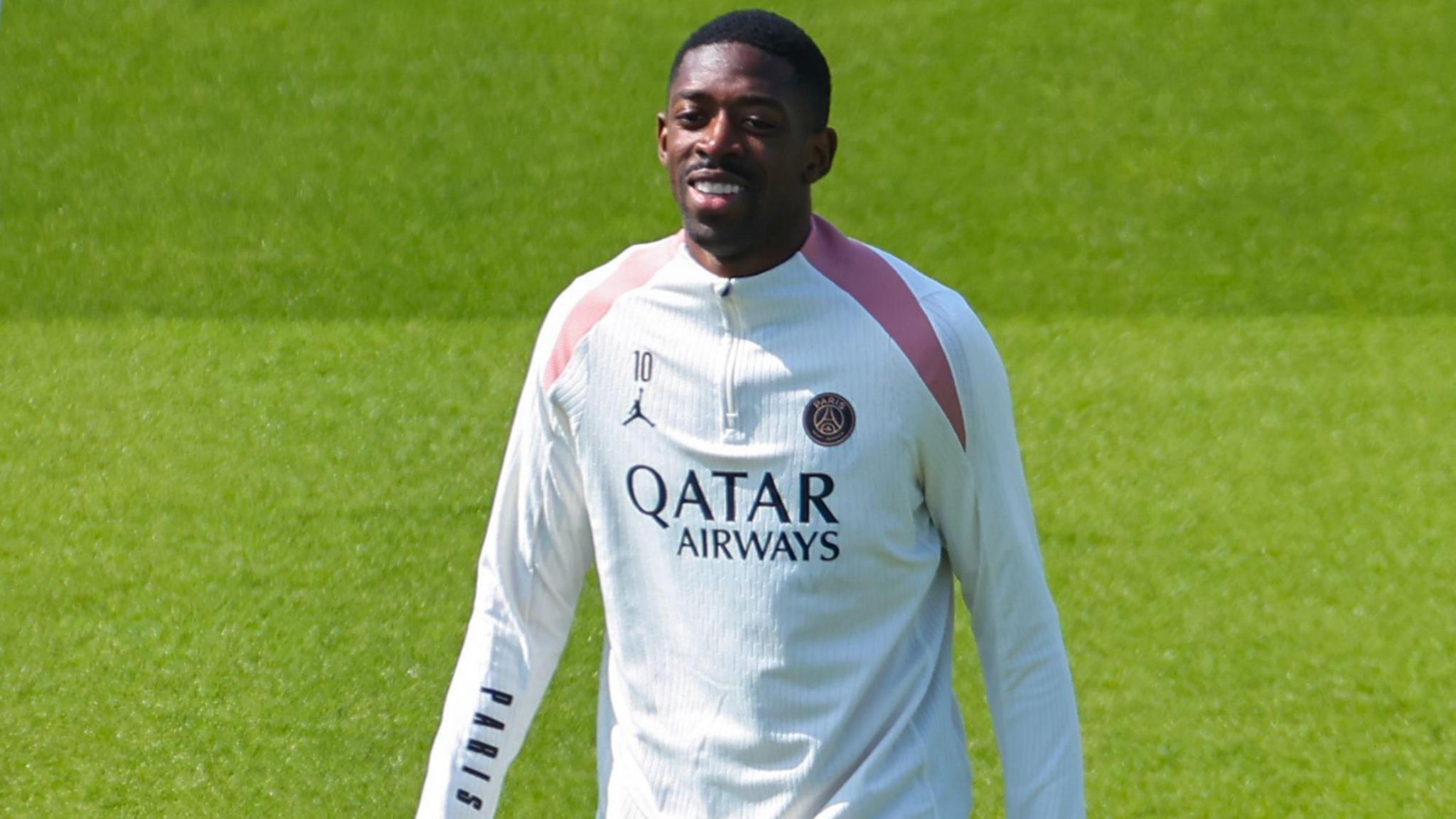 Ousmane Dembele smiling during Paris St-Germain training.