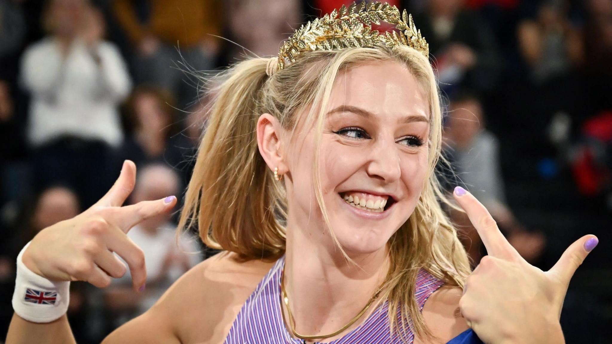 Molly Caudery celebrates after winning world indoor gold