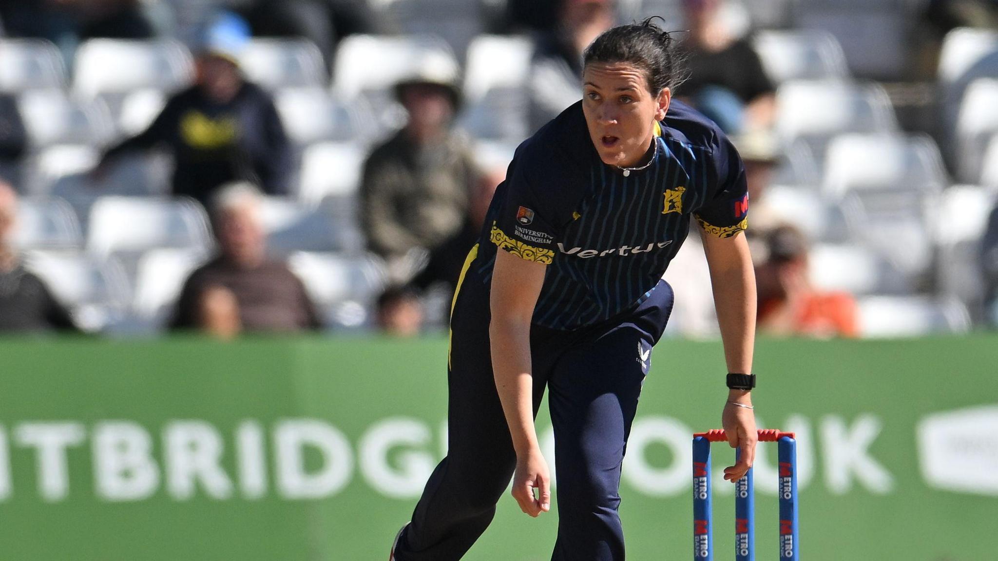 Em Arlott delivers the ball in her follow through for Warwickshire.