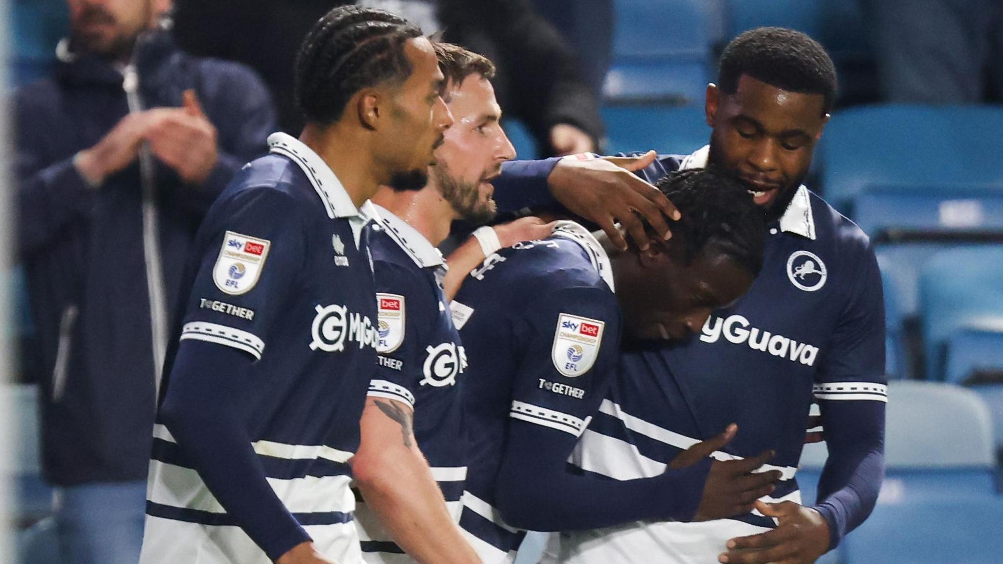 Millwall players celebrate after Romain Esse scores