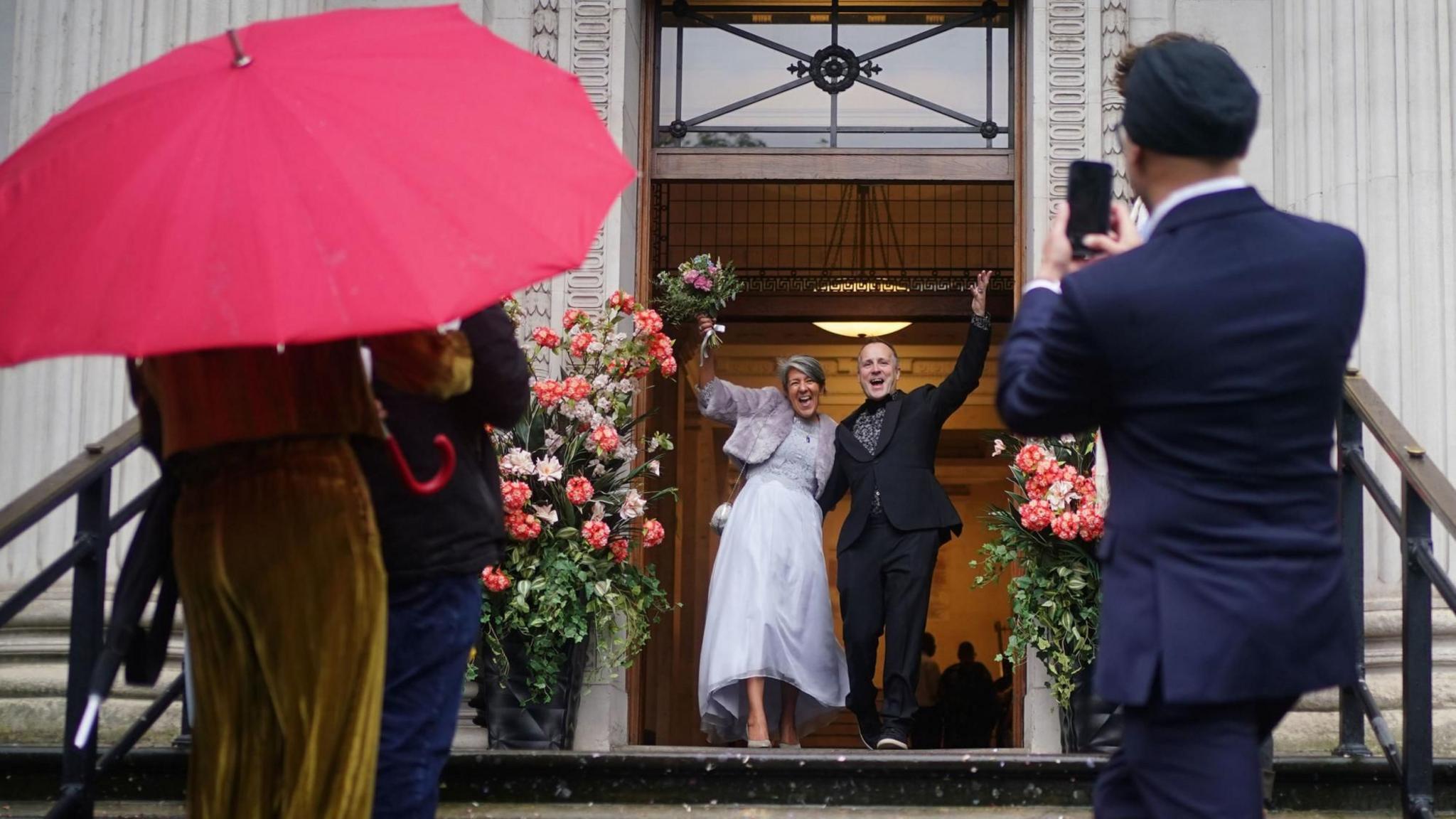 Ian Elliot, 54, and Paula Diaz, 50, following their civil partnership ceremony at at Old Marylebone Town Hall 