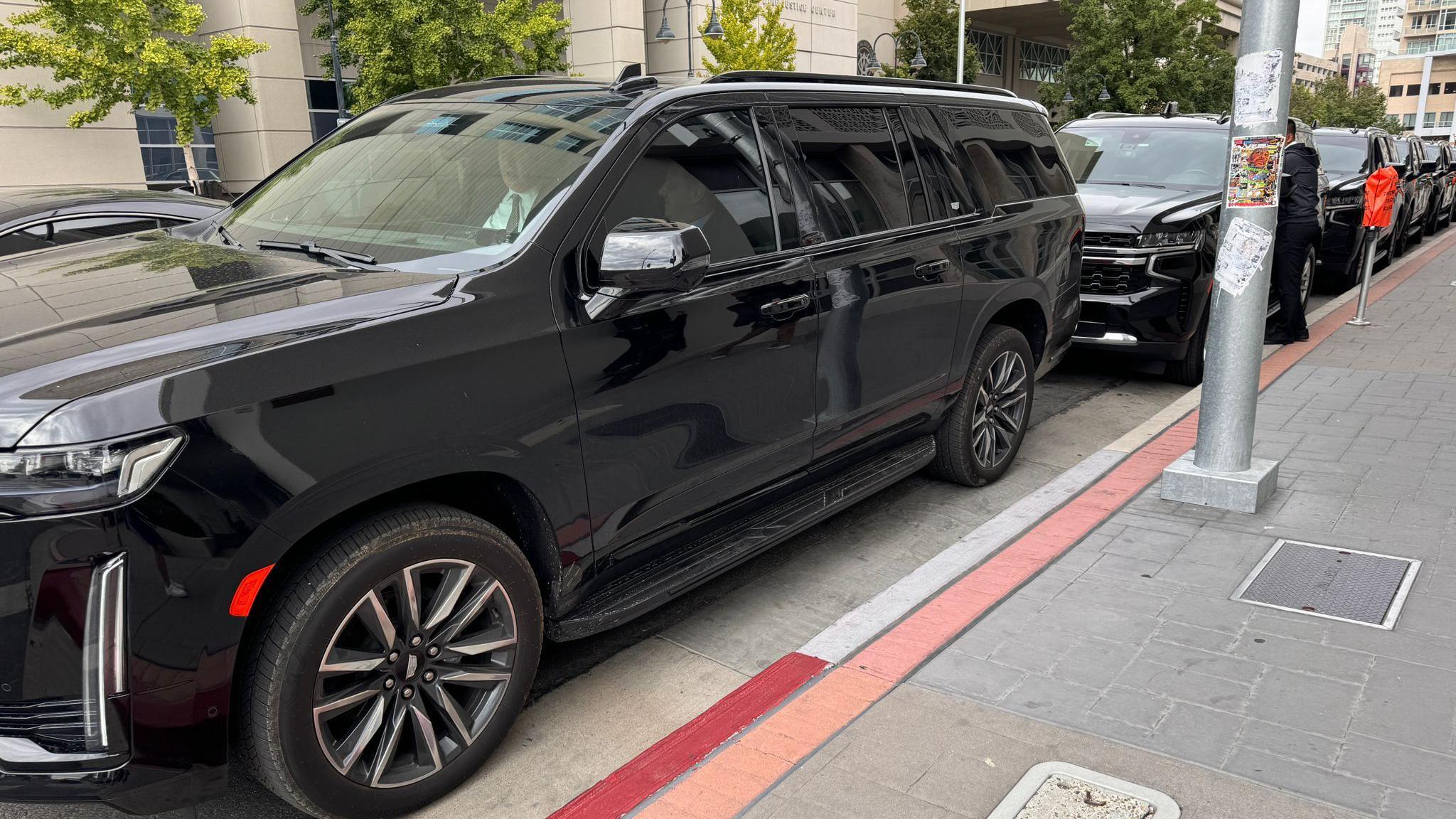 Black SUVs outside courthouse