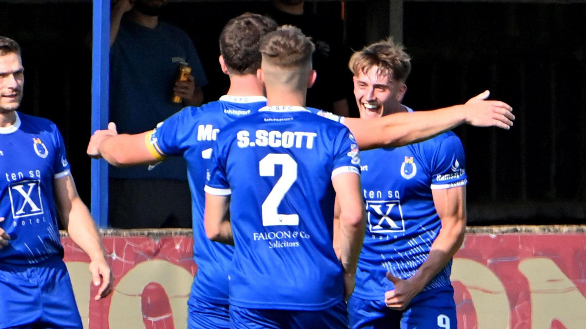 Dungannon players congratulate goalscorer John McGovern