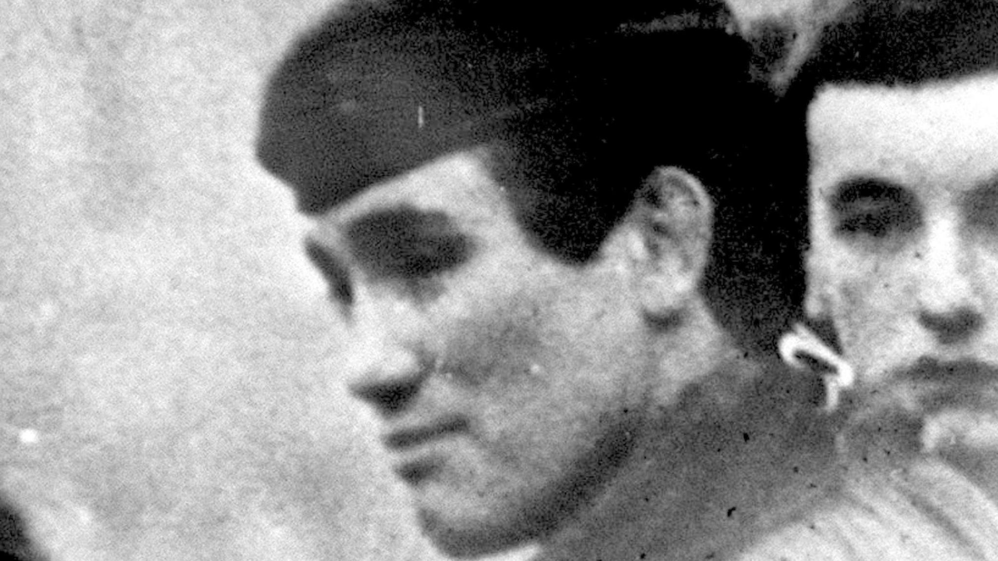 Archive black and white image showing Captain Nairac close up wearing beret