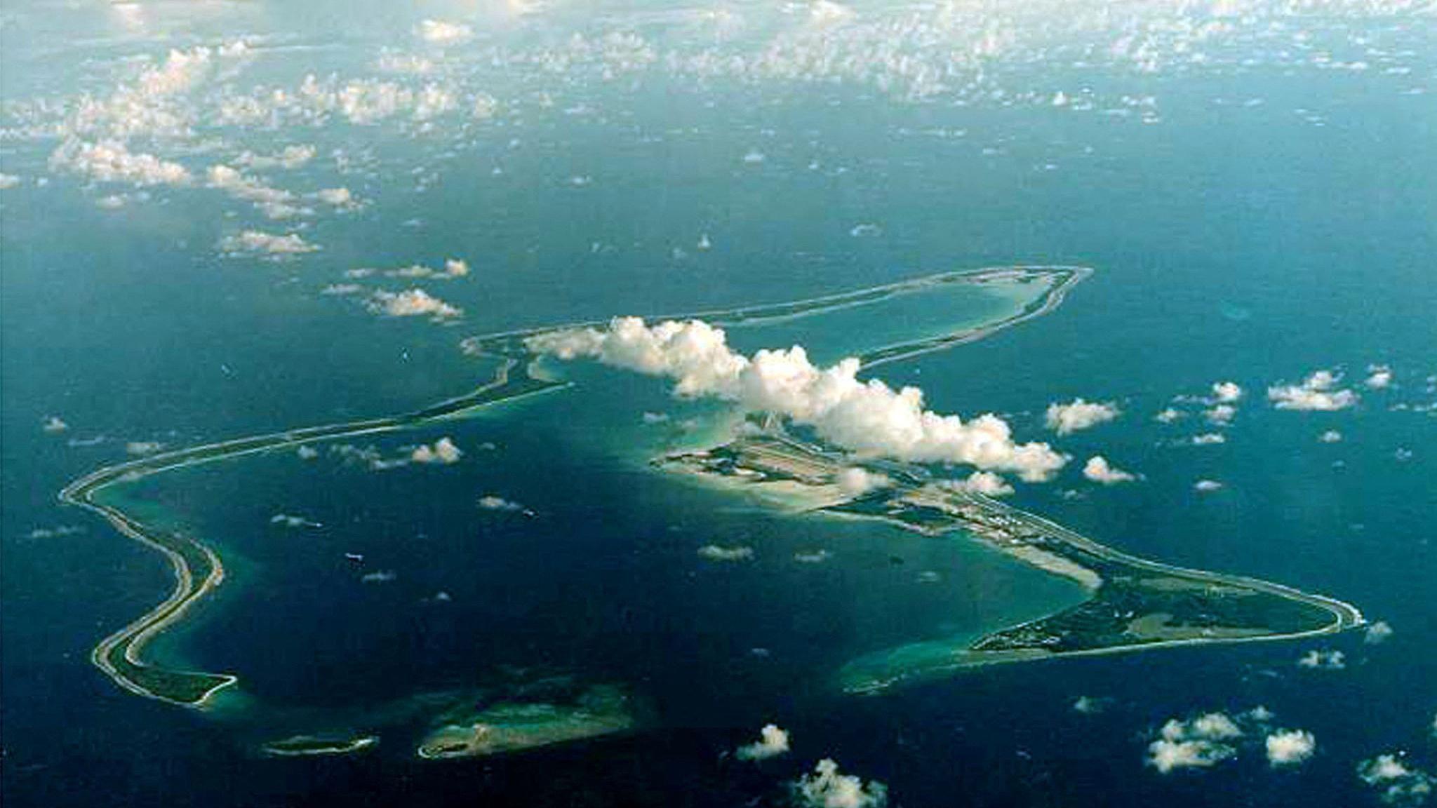 A birds-eye view of Diego Garcia, the largest island in the Chagos archipelago and site of a major United States military base, in the blue Indian Ocean