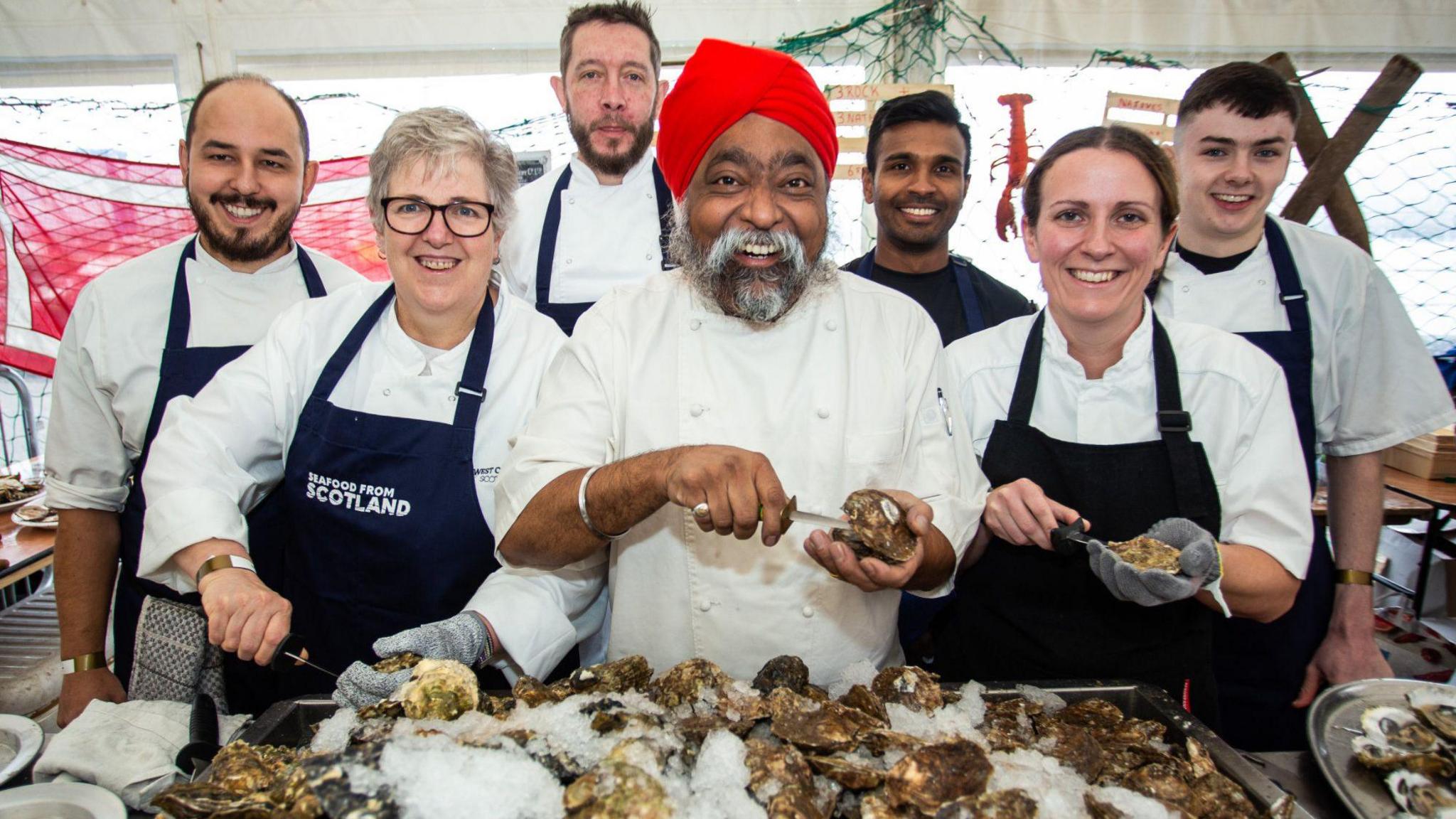 Tony Singh with oyster shucking competitors