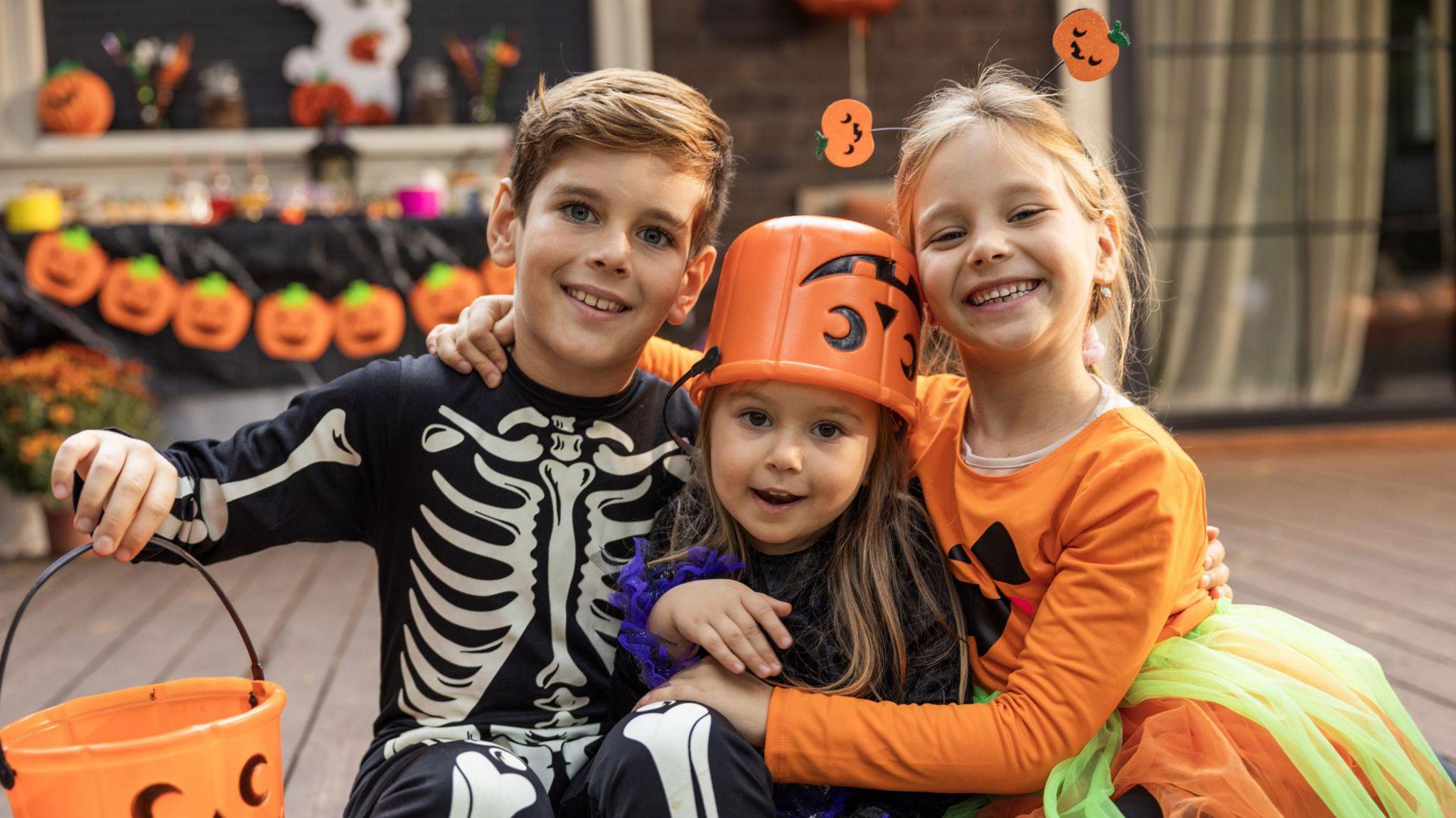 Children sat on porch dressed up