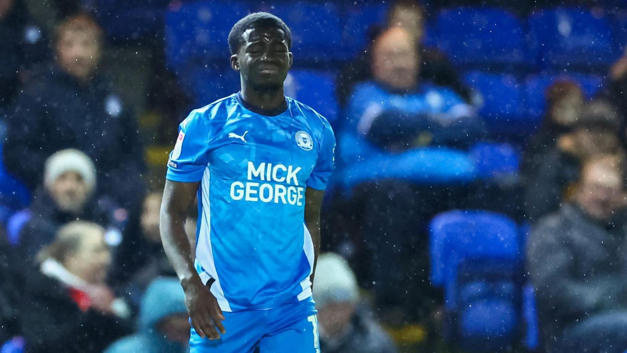 Peterborough's Kwame Poku leaves the field against Burton Albion