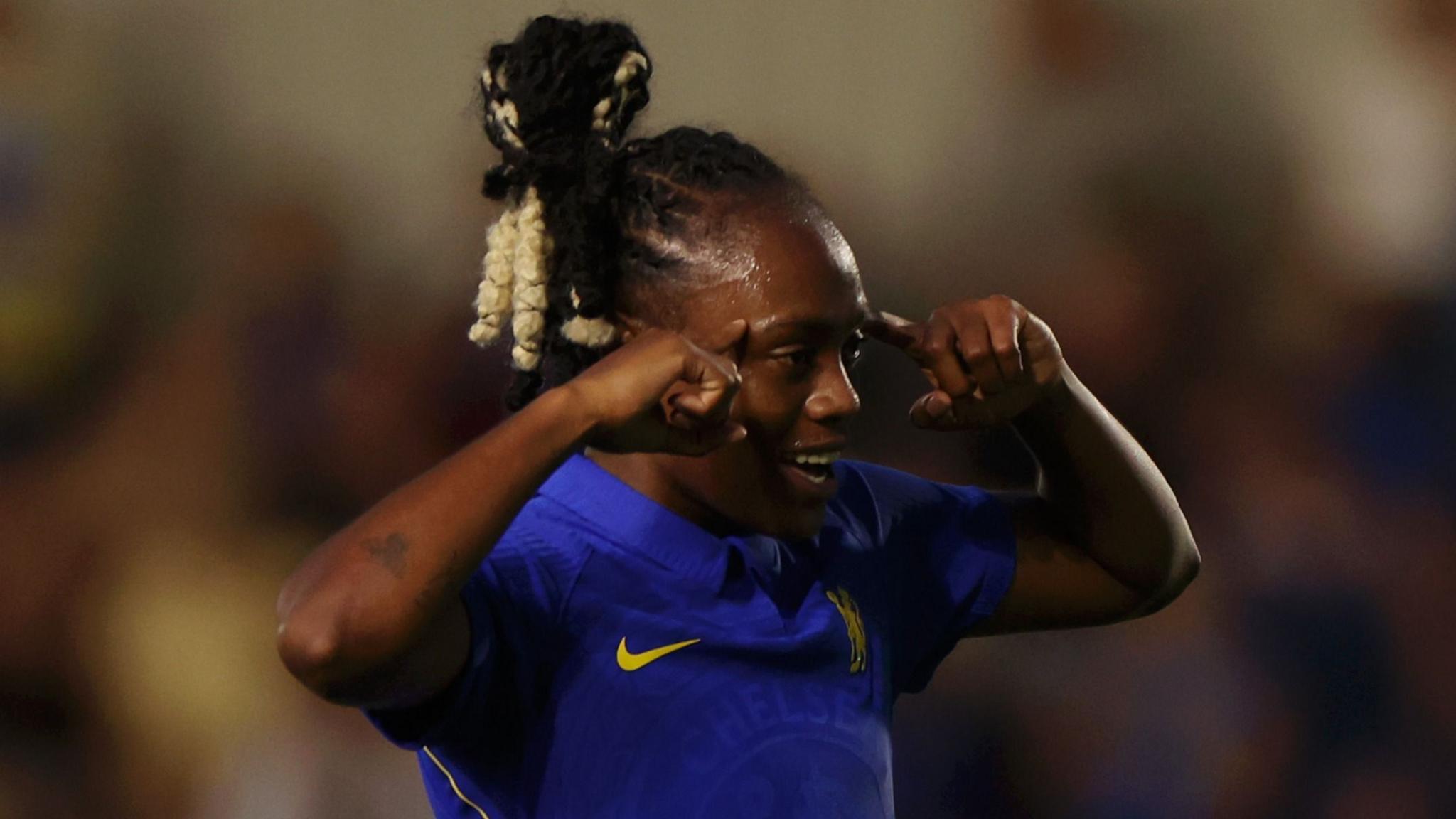  Melvine Malard of Chelsea celebrates with teammate Ellie Carpenter after scoring her team's third goal