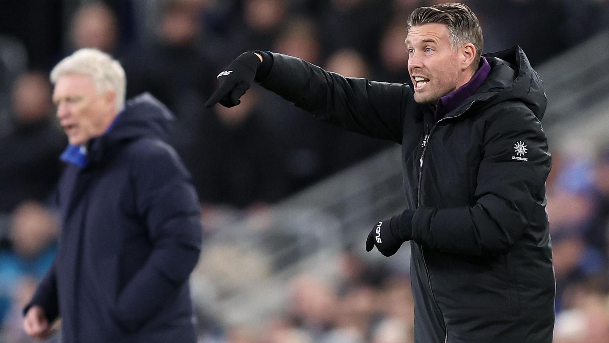 Rob Edwards issuing instructions on the touchline, with Everton manager David Moyes in the background