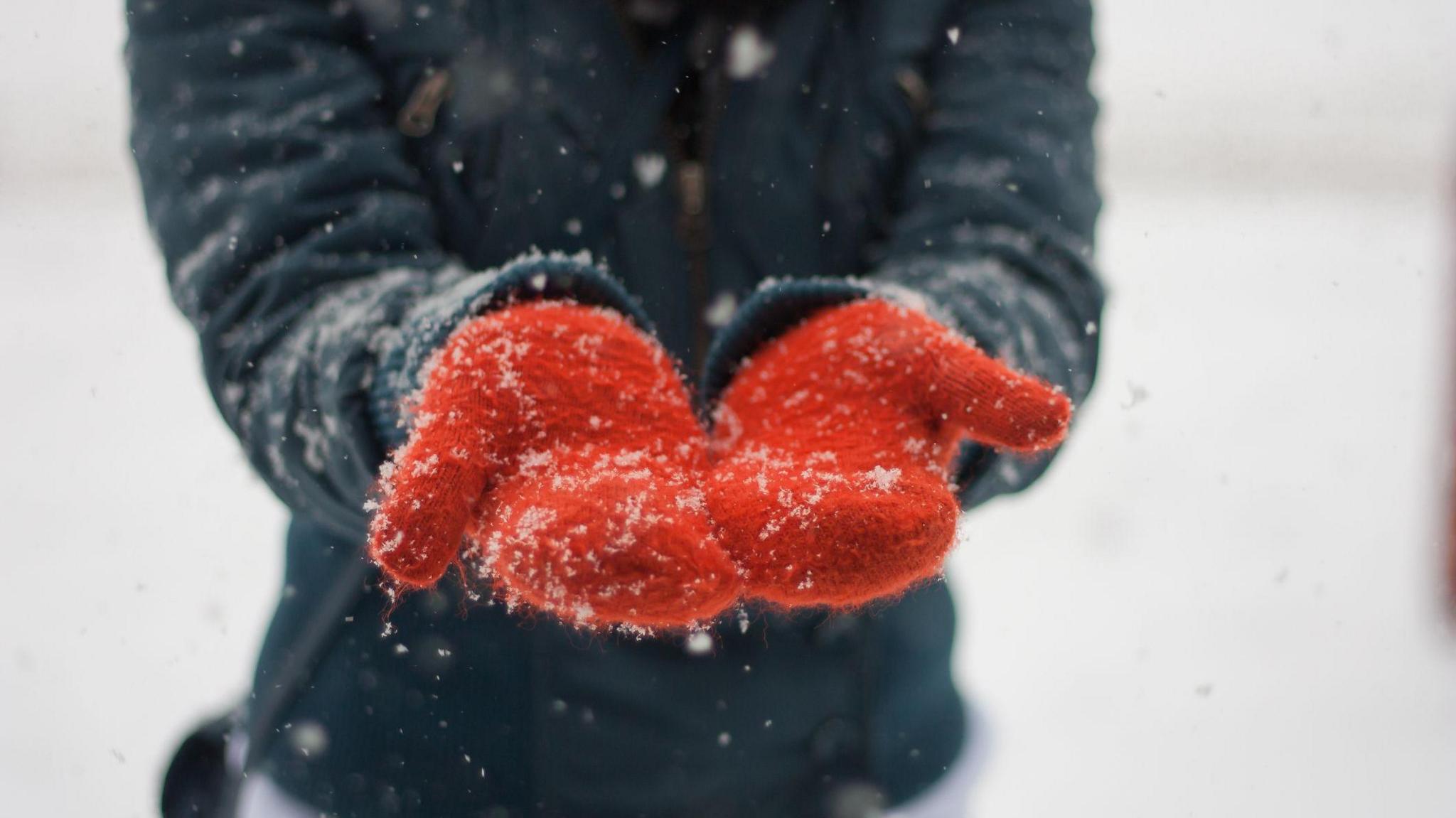 Girl catching snow 