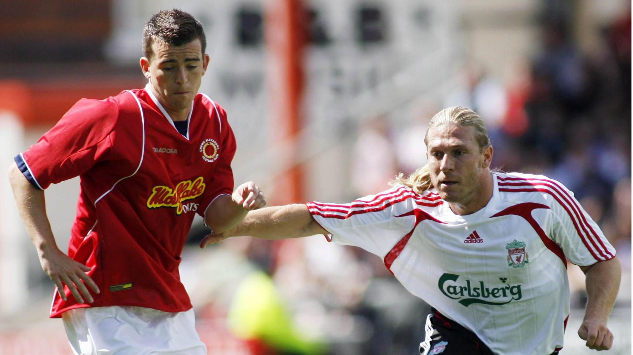 Steven Schumacher tangles with Liverpool's Andriy Voronin in a pre-season friendly at Gresty Road