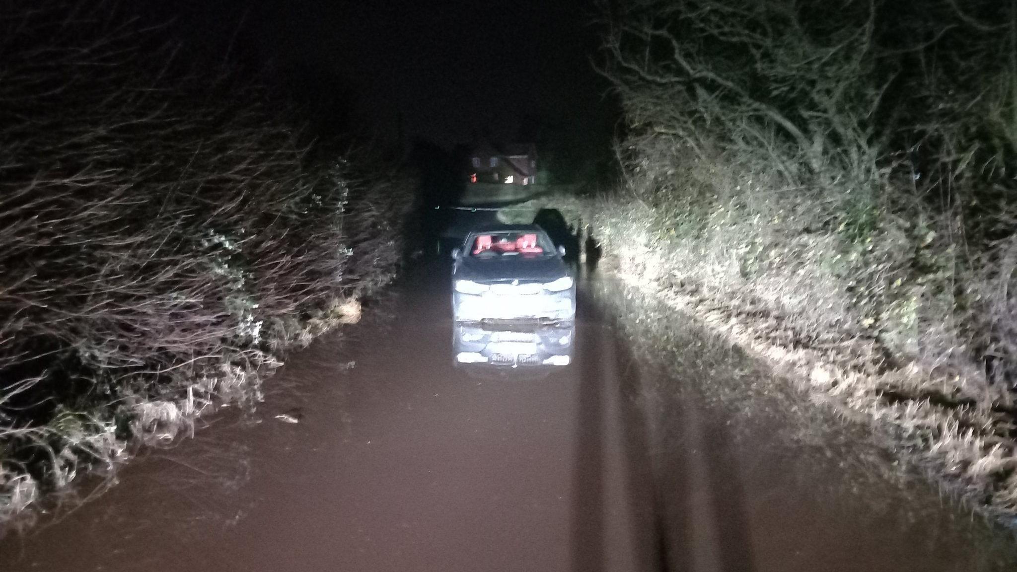 A car stranded in flood water