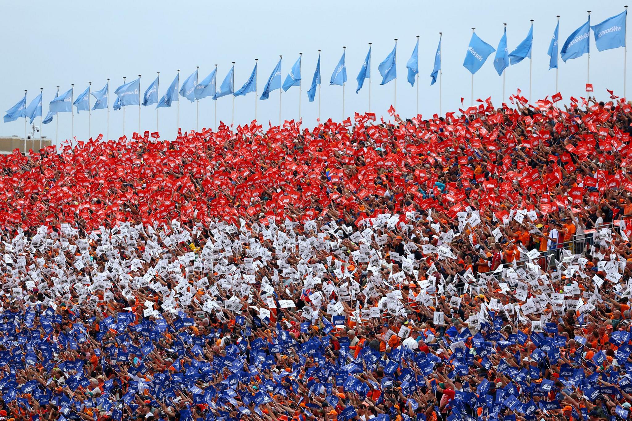 Fans form the Dutch flag colours in a grandstand prior to the F1 Grand Prix of Netherlands at Circuit Zandvoort in Zandvoort, Netherlands. Photo by Clive Rose