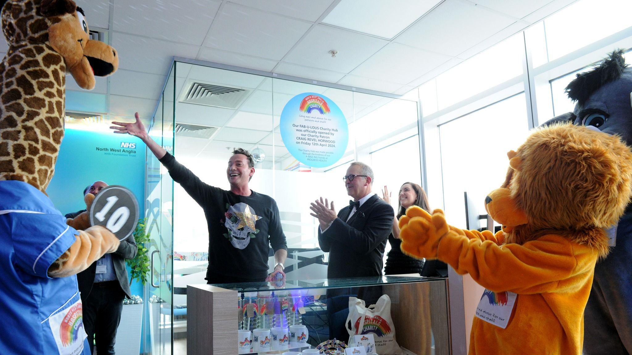 Craig Revel Horwood with charity mascots at the charity hub's opening 