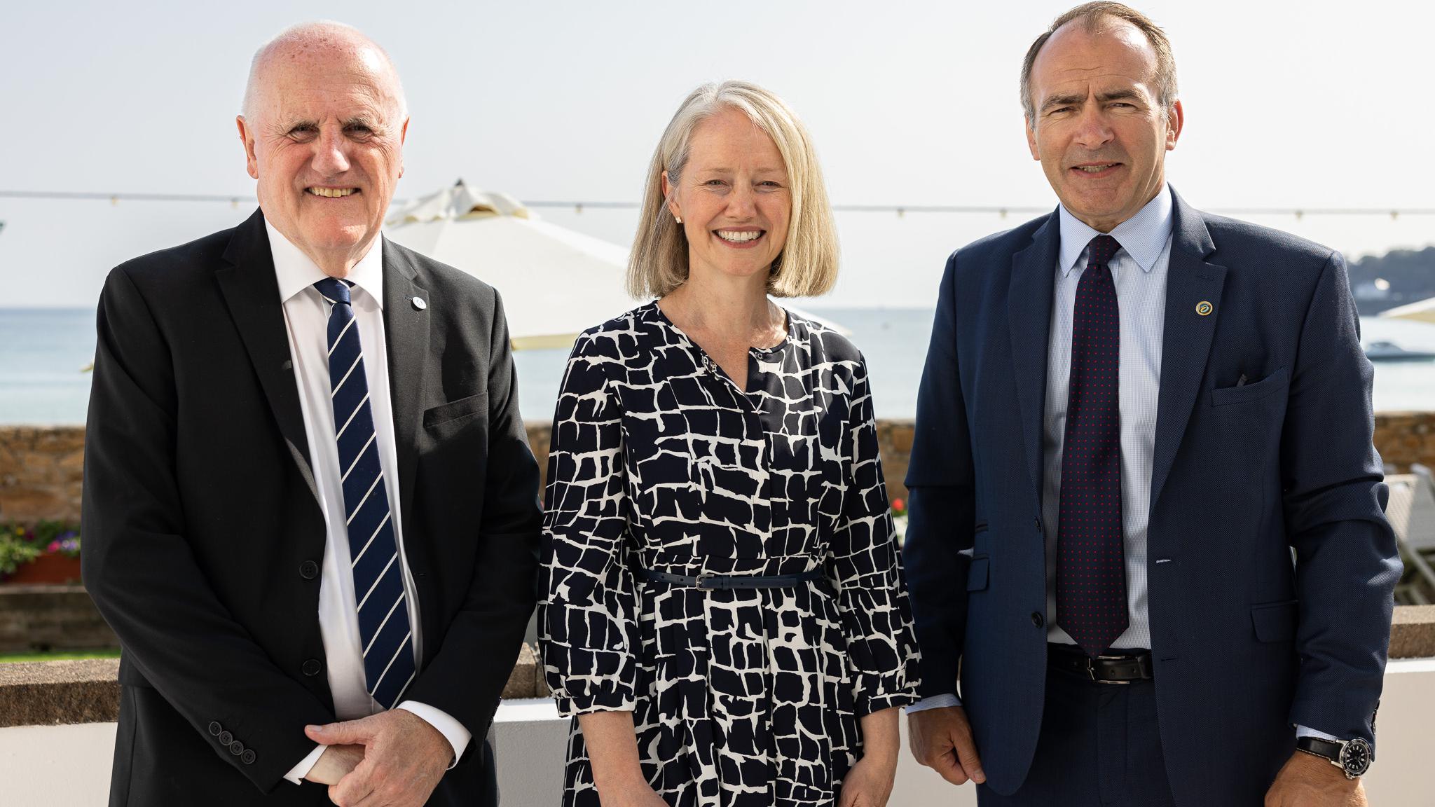 Group photo of leaders at beach front location