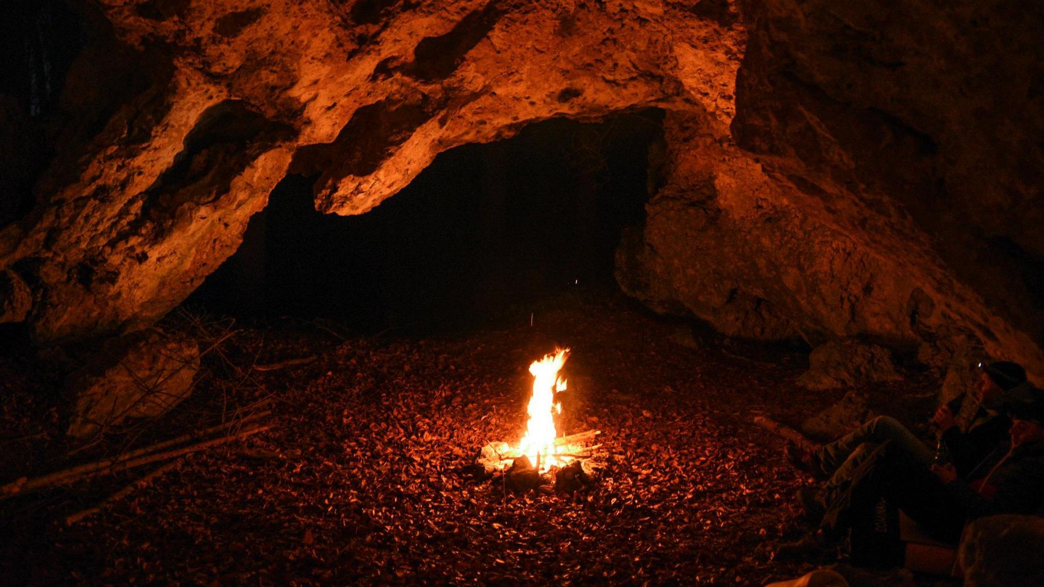 a small fire in a cave