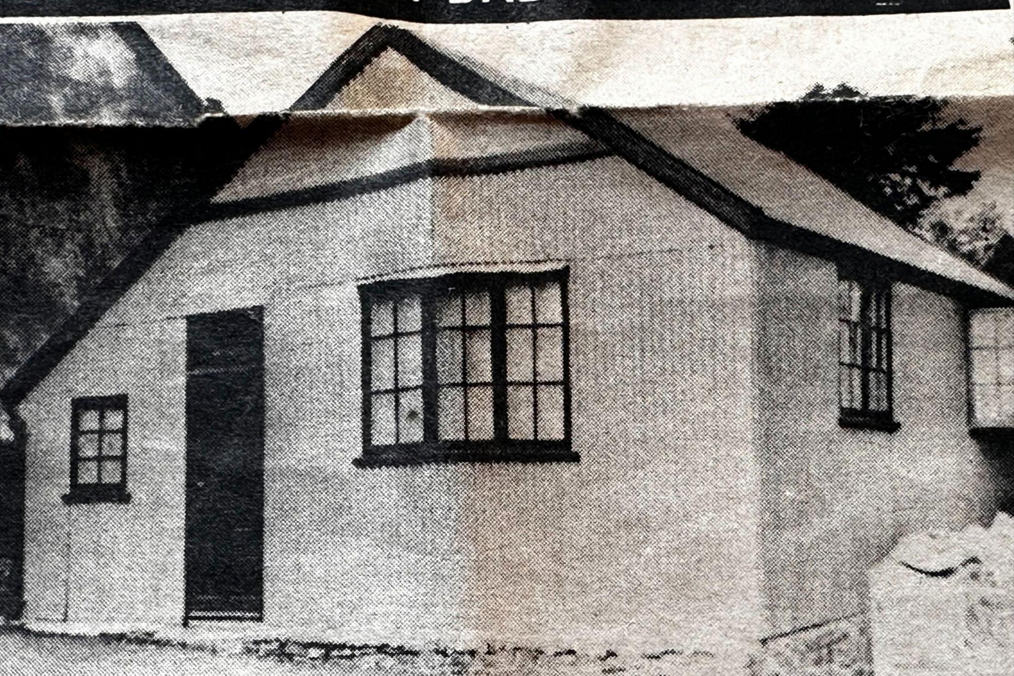 A newspaper clipping from the Coal News showing the corrugated iron structure which housed Agnes' first snooker table and the shop from which she sold sweets and cigarettes. It is no bigger than a conventional garage. It shows a peaked roof, the main door, with front and side windows.