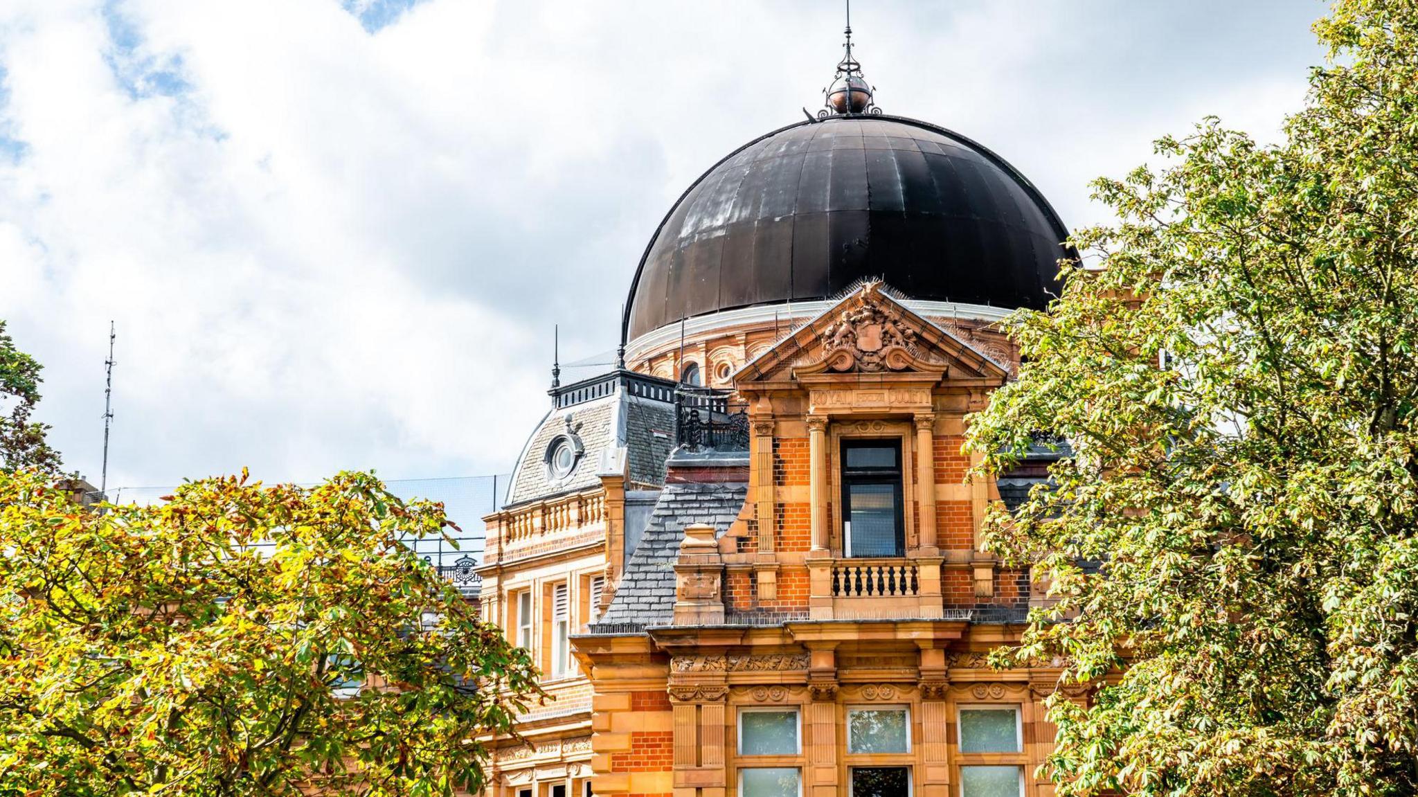 Greenwich Observatory in London a red bricked building with a dome