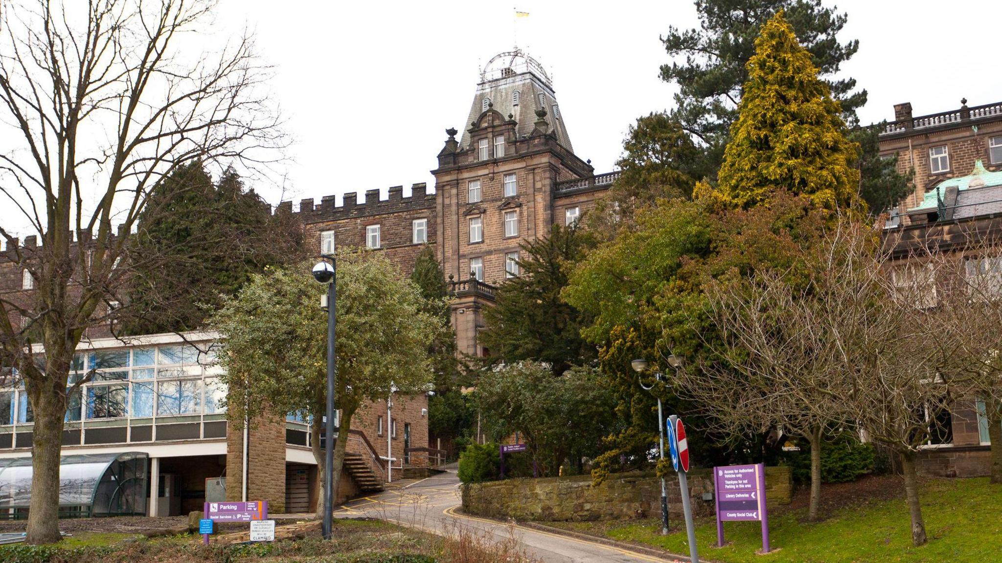 Matlock County Hall, which houses Derbyshire County Council
Listed building with grey stone and large trees outside 