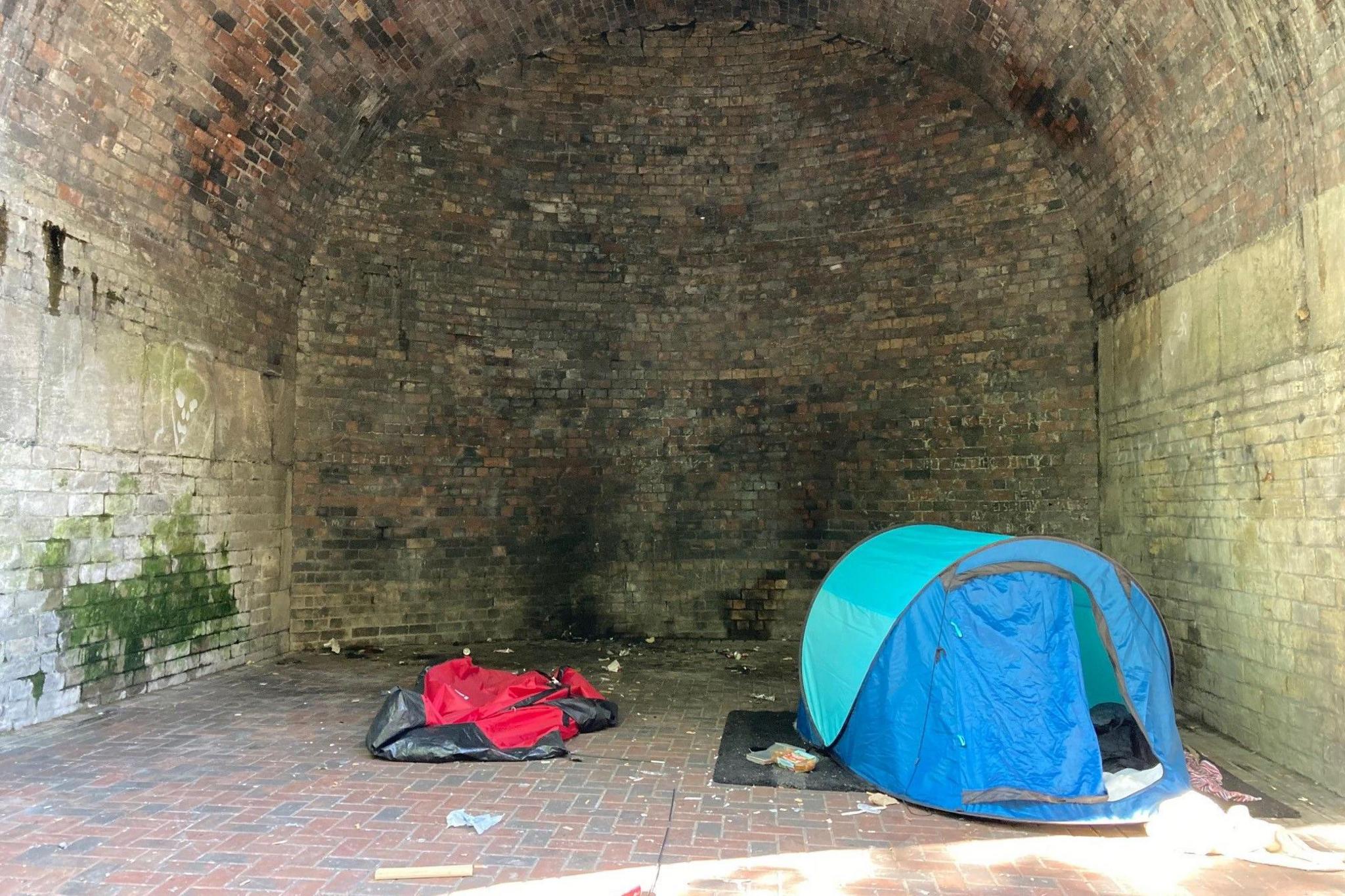 A tent in one of the arches before they were fenced off