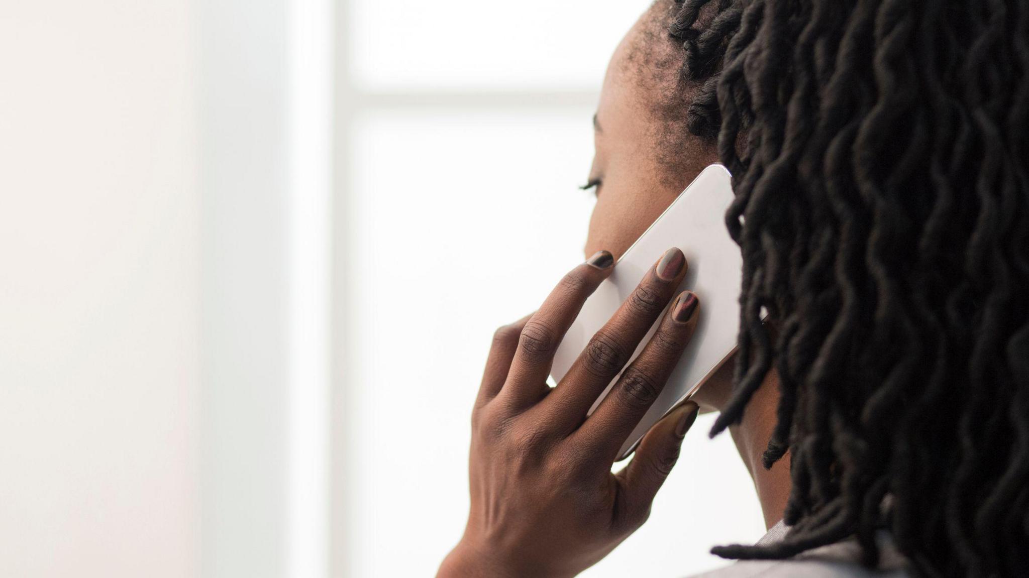 A woman making a call with a mobile phone 