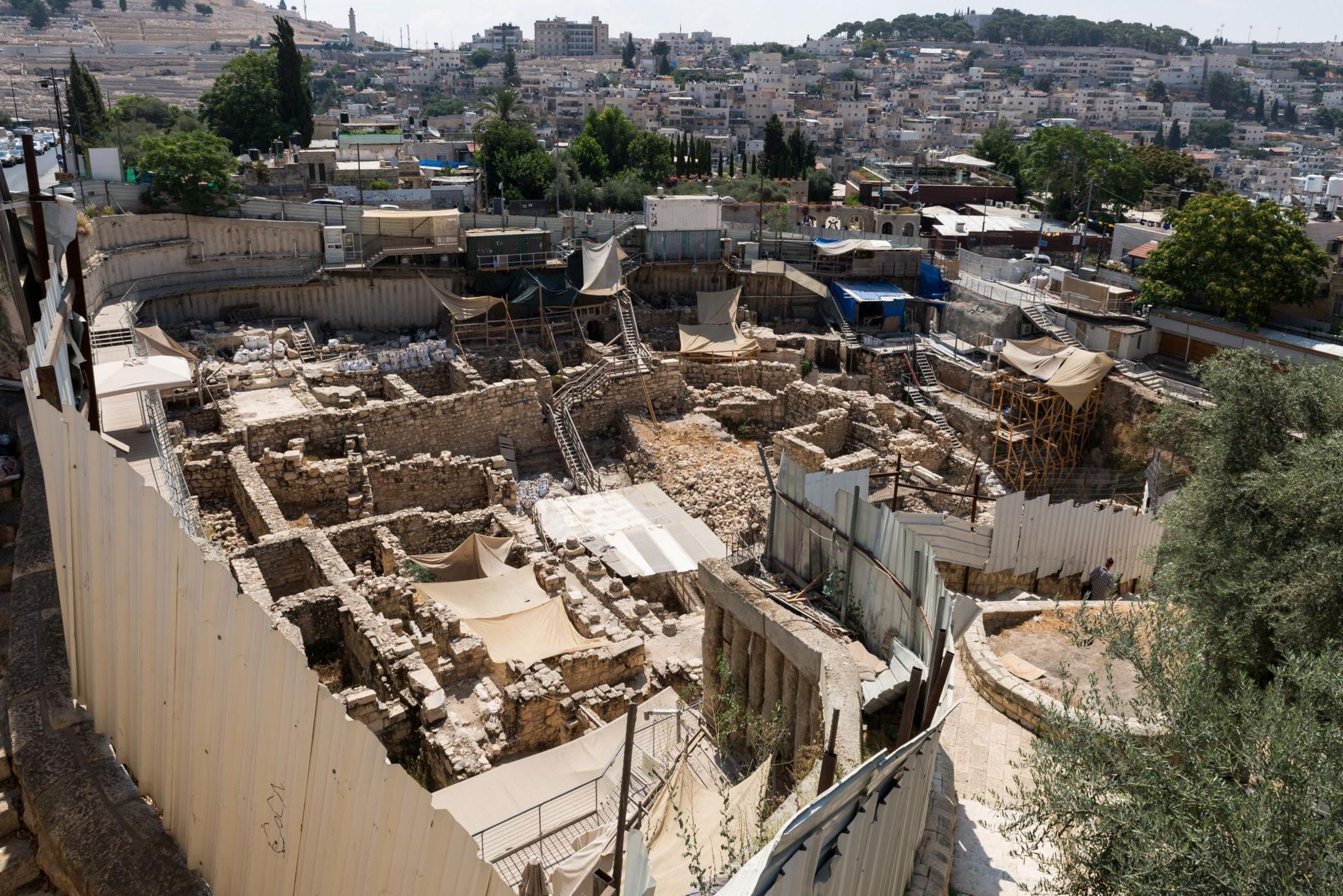 The excavation site with modern buildings of Jerusalem in the background.