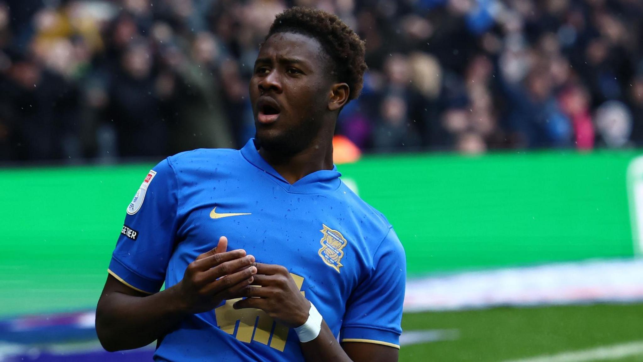 Ibrahim Osman slides on his knees in celebration at scoring his first Birmingham goal to give the Blues the lead against Leicester