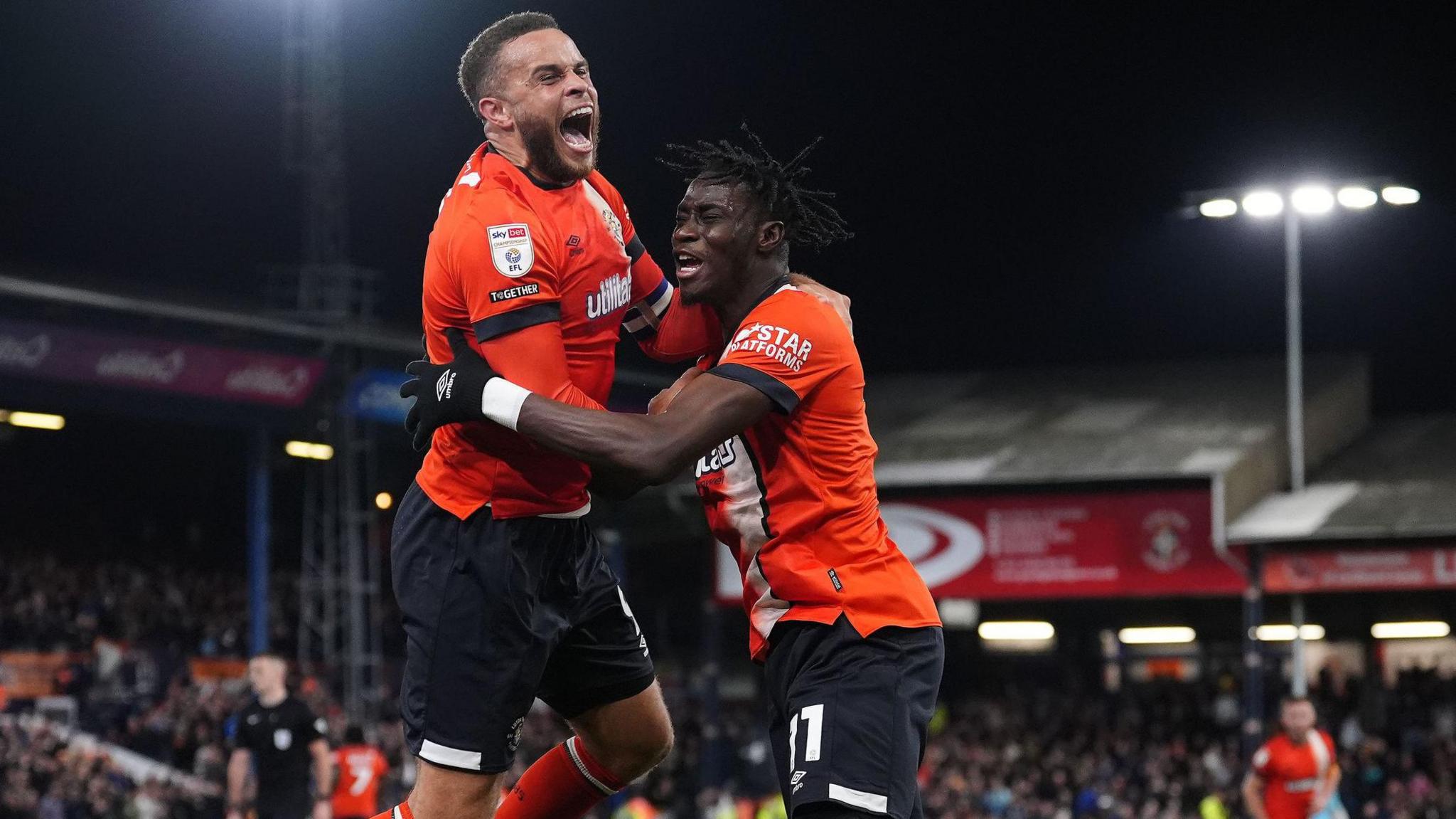 Luton's twin towers Carlton Morris (left) and Elijah Adebayo celebrate another home goal at Kenilworth Road