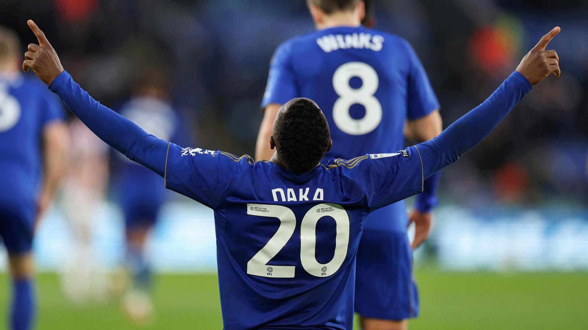 Leicester City's Patson Daka kneeling and pointing up to the sky