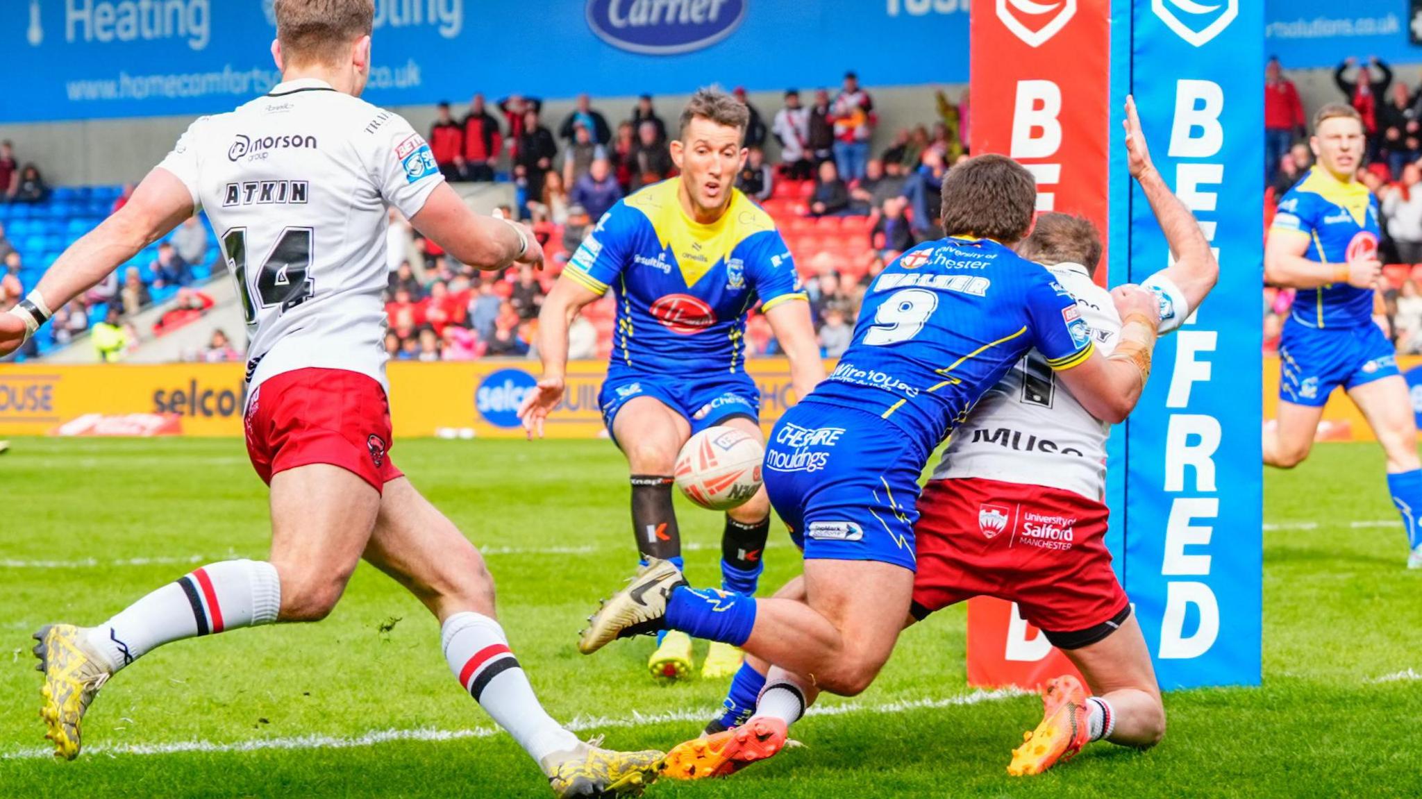 Danny Walker makes a no-ball tackle on Ryan Brierley