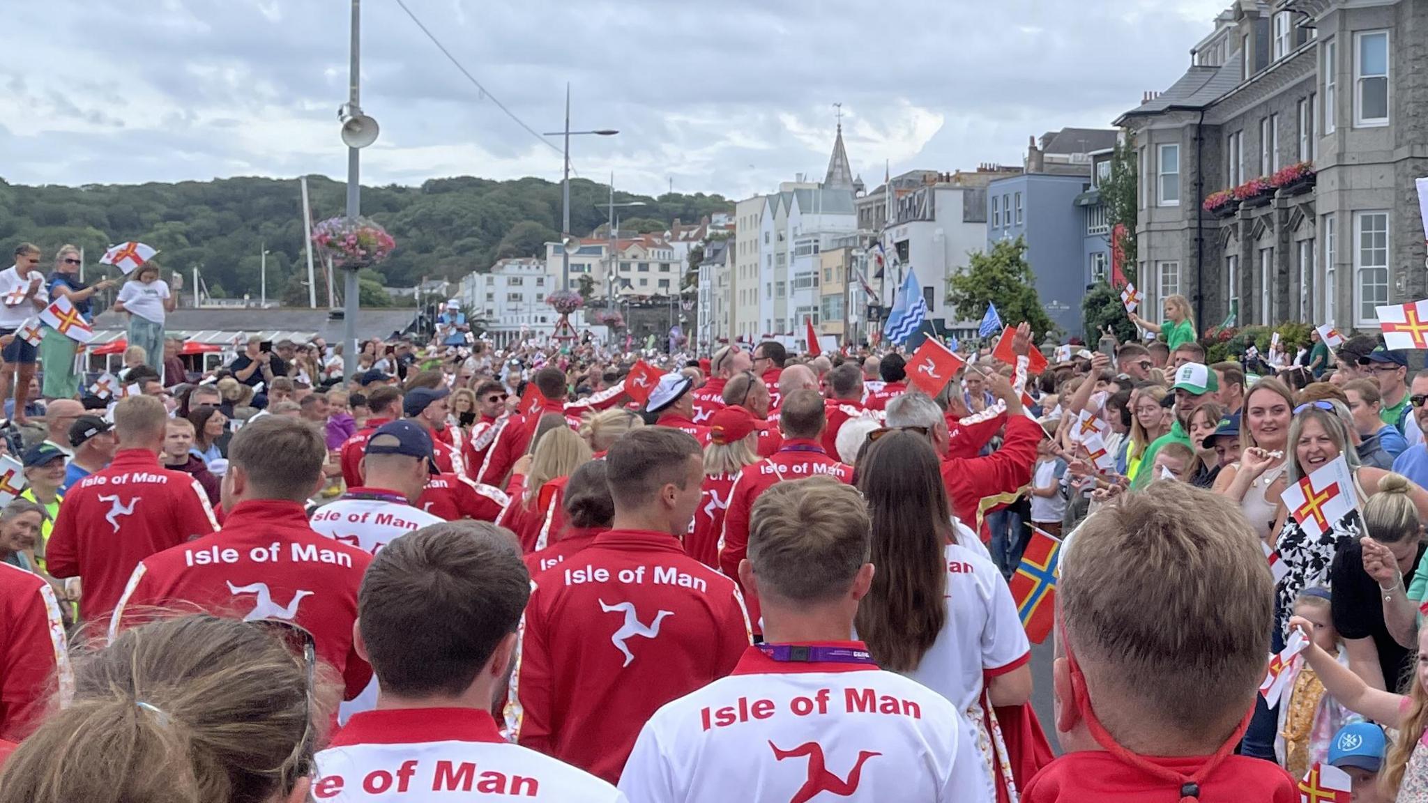 Team Isle of Man on Guernsey seafront with lots of wellwishers