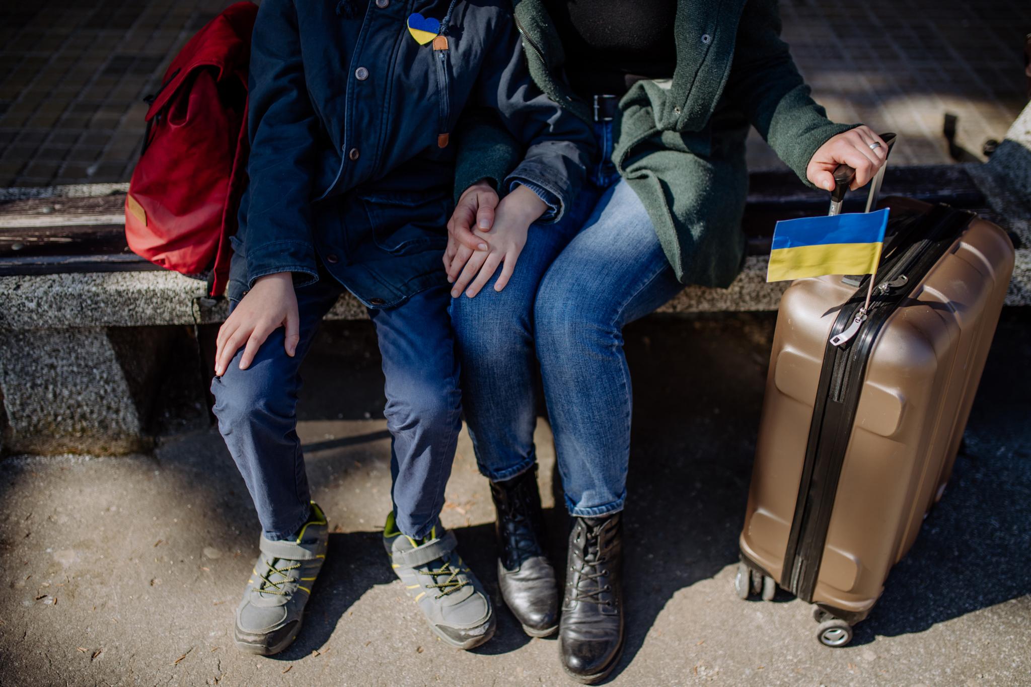 Ukrainian refugees with bags