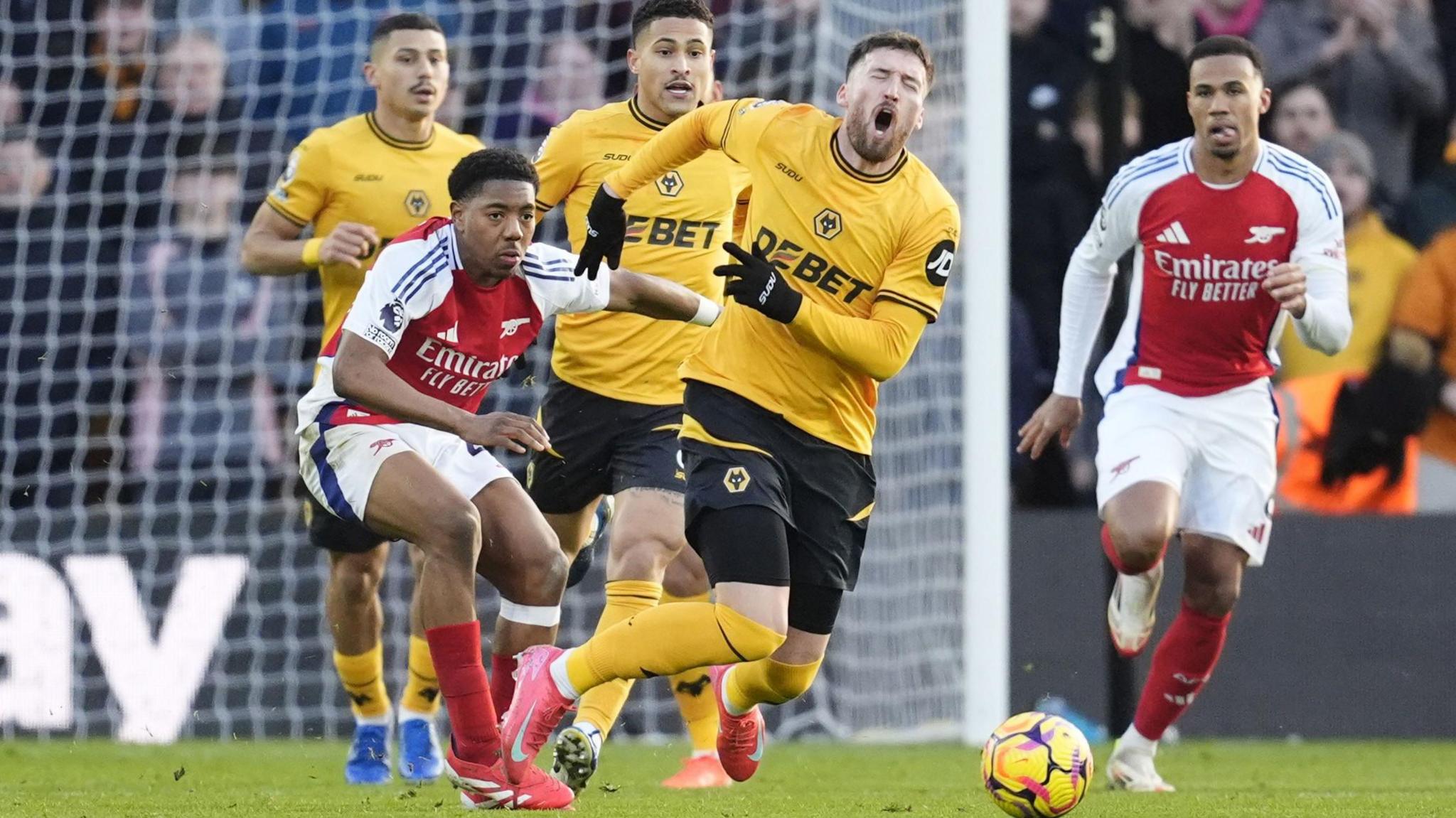 Wolves' Matt Doherty is fouled by Myles Lewis-Skelly, for which the Arsenal defender was sent off