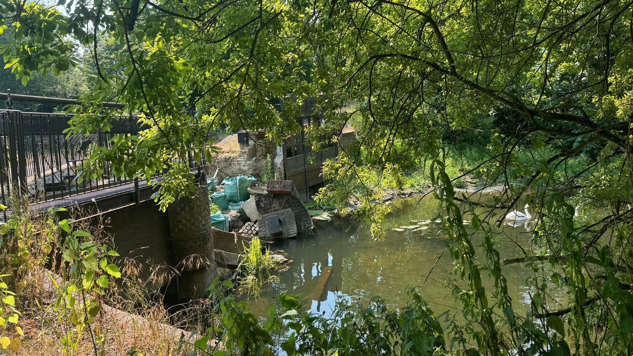 A weir in Colchester where brickwork has collapsed into the River Colne